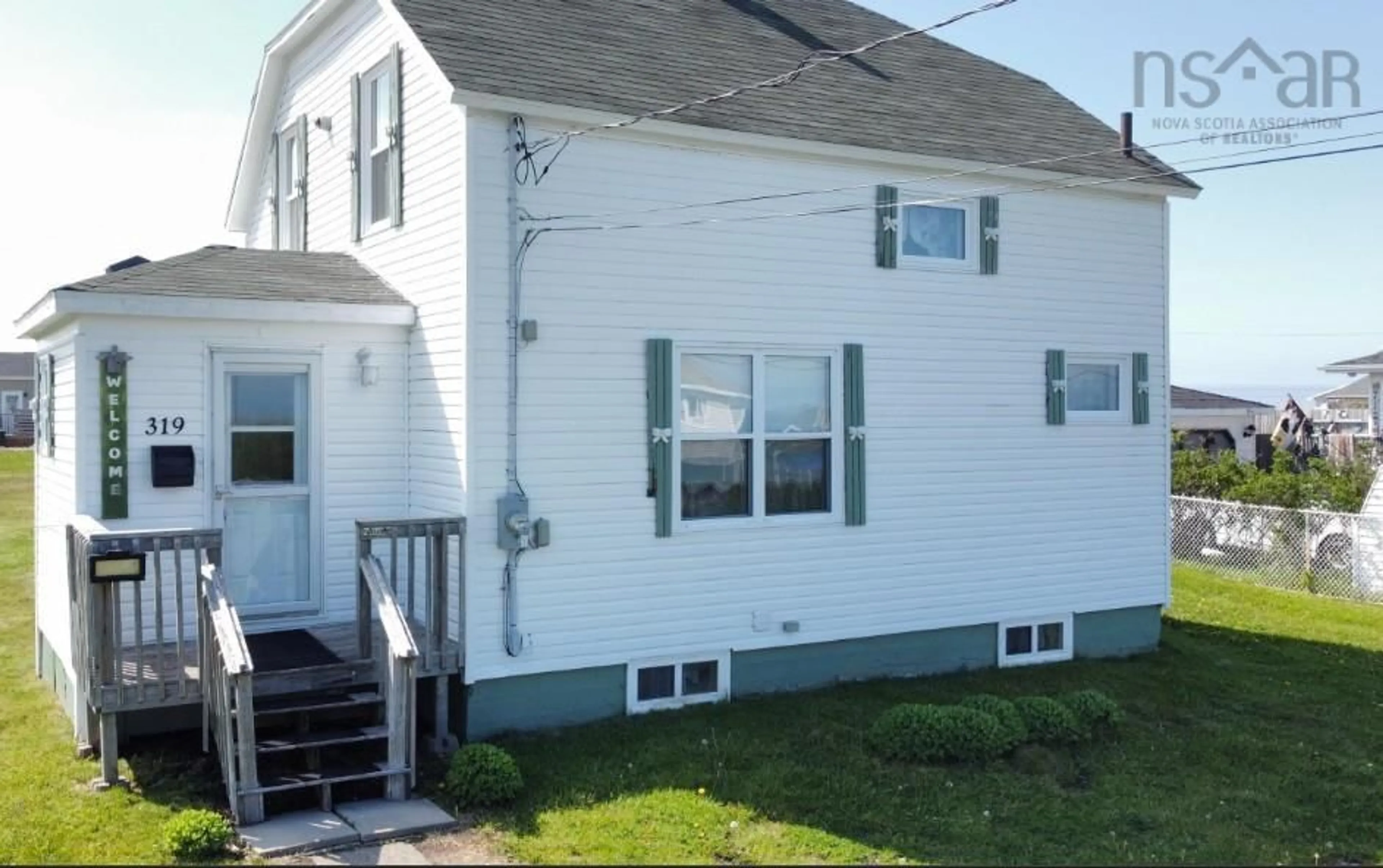 Home with vinyl exterior material, street for 319 Cockburn St, New Waterford Nova Scotia B1J 4J8