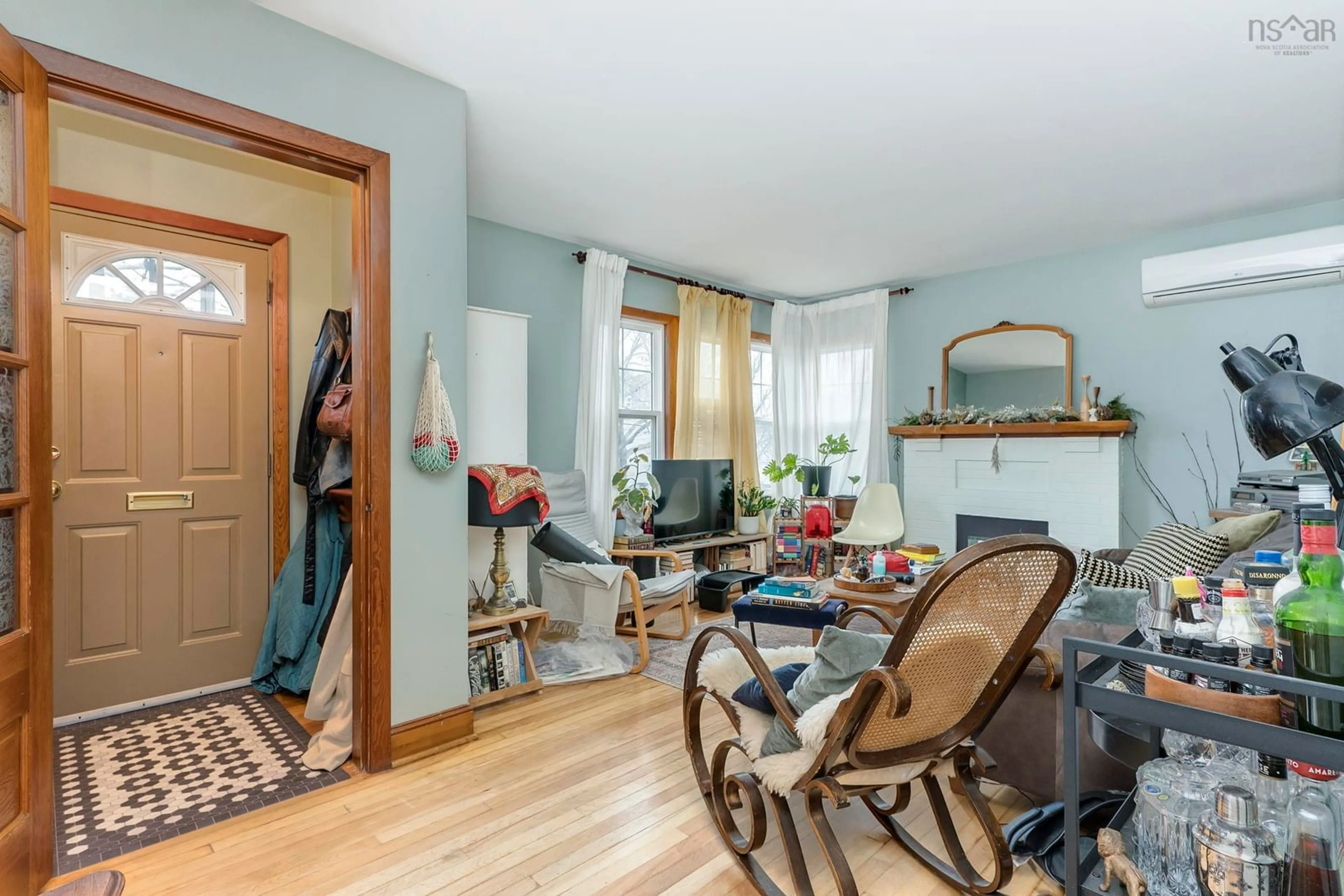 Living room with furniture, wood/laminate floor for 7142 Abbott Dr, Halifax Nova Scotia B3L 2L7