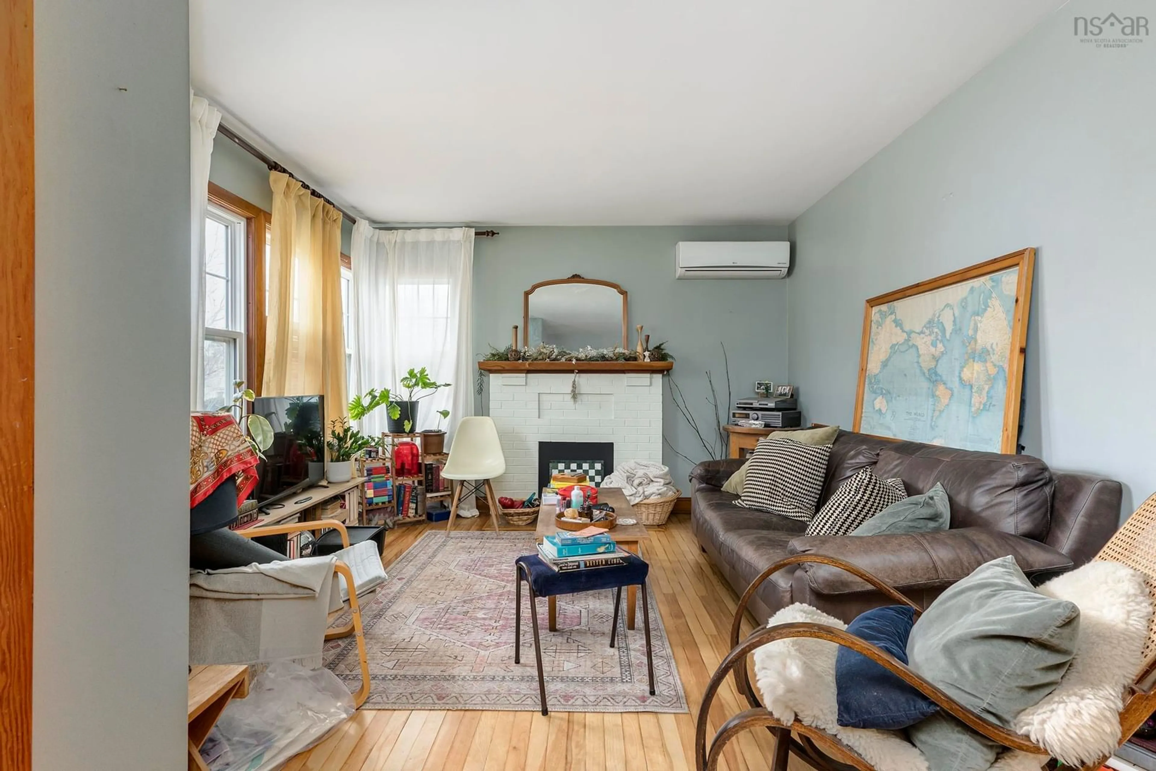 Living room with furniture, wood/laminate floor for 7142 Abbott Dr, Halifax Nova Scotia B3L 2L7