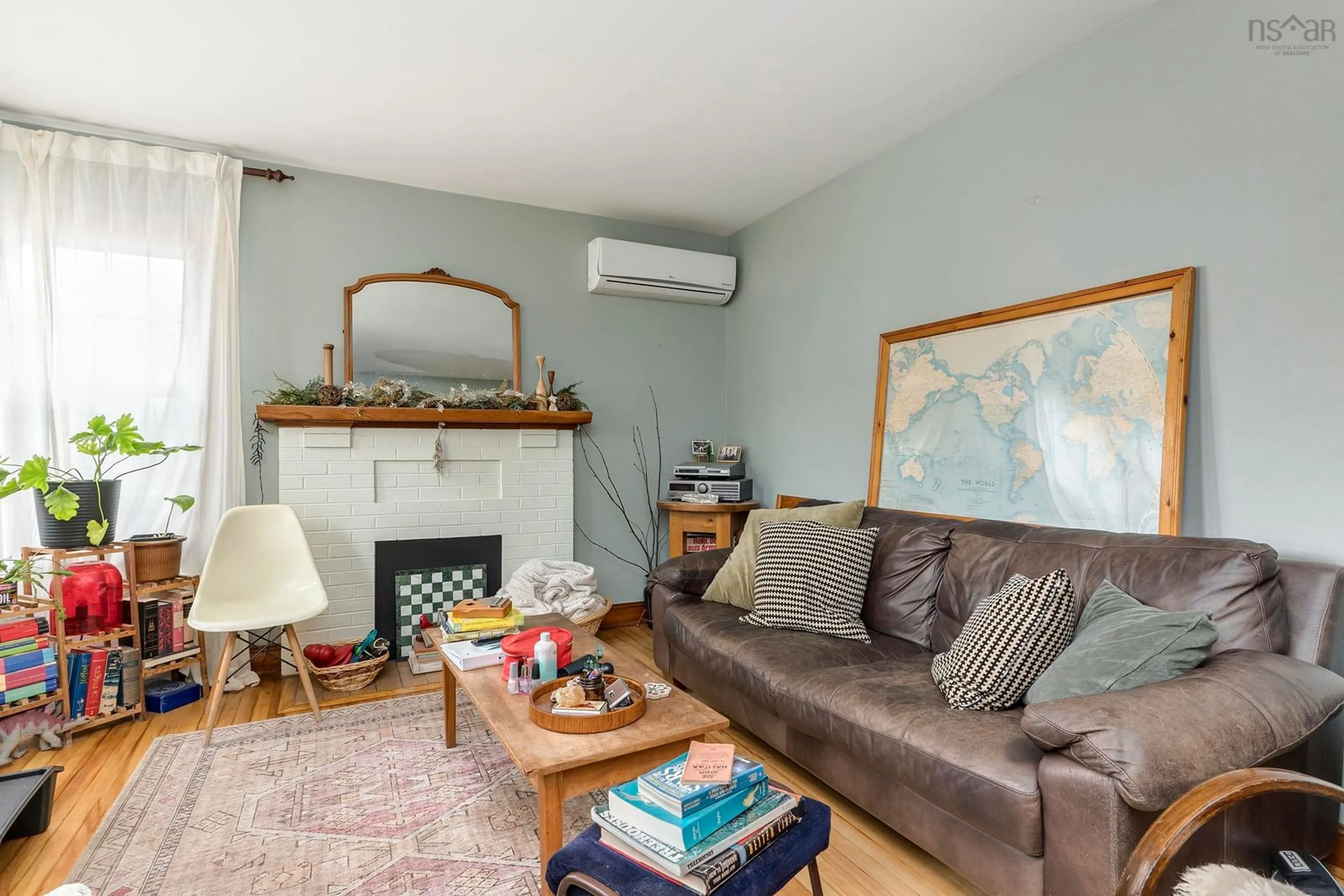 Living room with furniture, wood/laminate floor for 7142 Abbott Dr, Halifax Nova Scotia B3L 2L7
