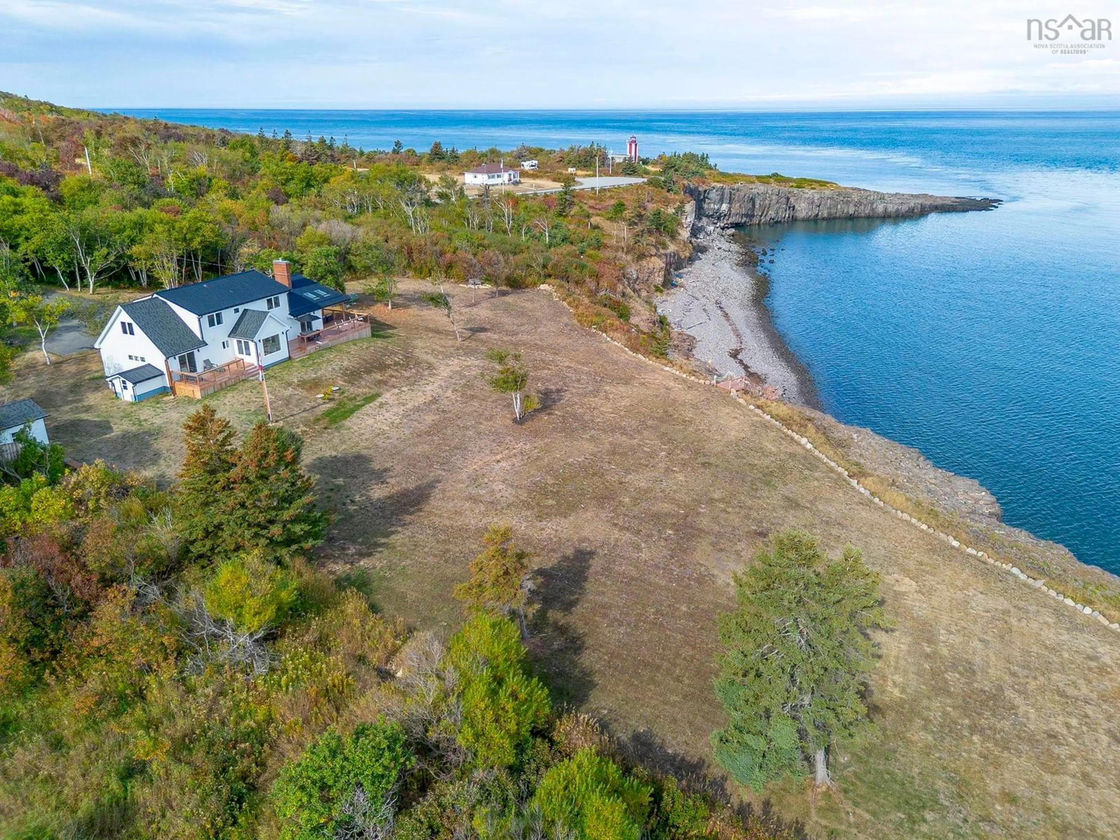 A pic from outside/outdoor area/front of a property/back of a property/a pic from drone, water/lake/river/ocean view for 1392 Lighthouse Rd, Bay View Nova Scotia B0V 1A0