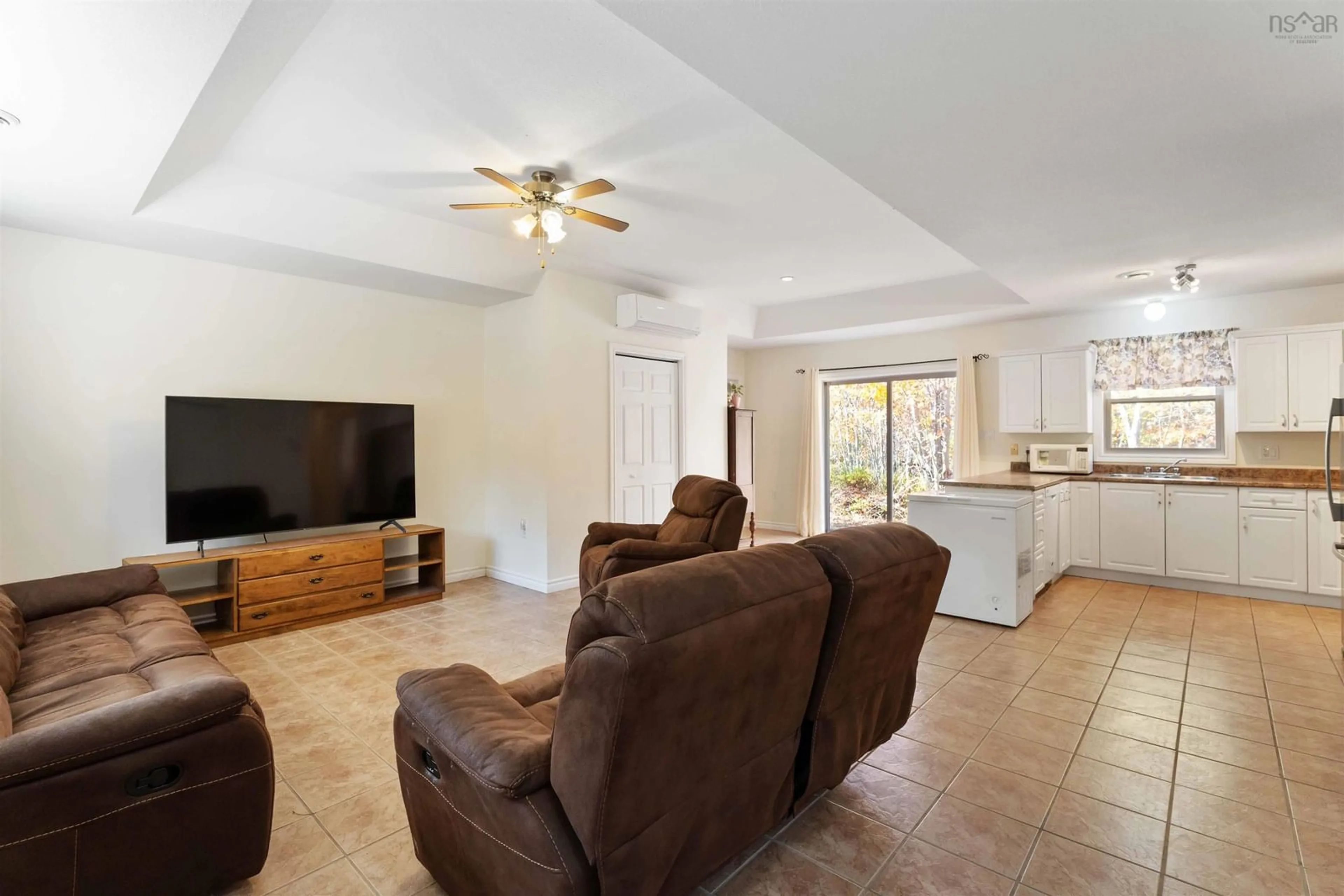 Living room with furniture, ceramic/tile floor for 1119 Victoria Rd, Aylesford Nova Scotia B0P 1C0