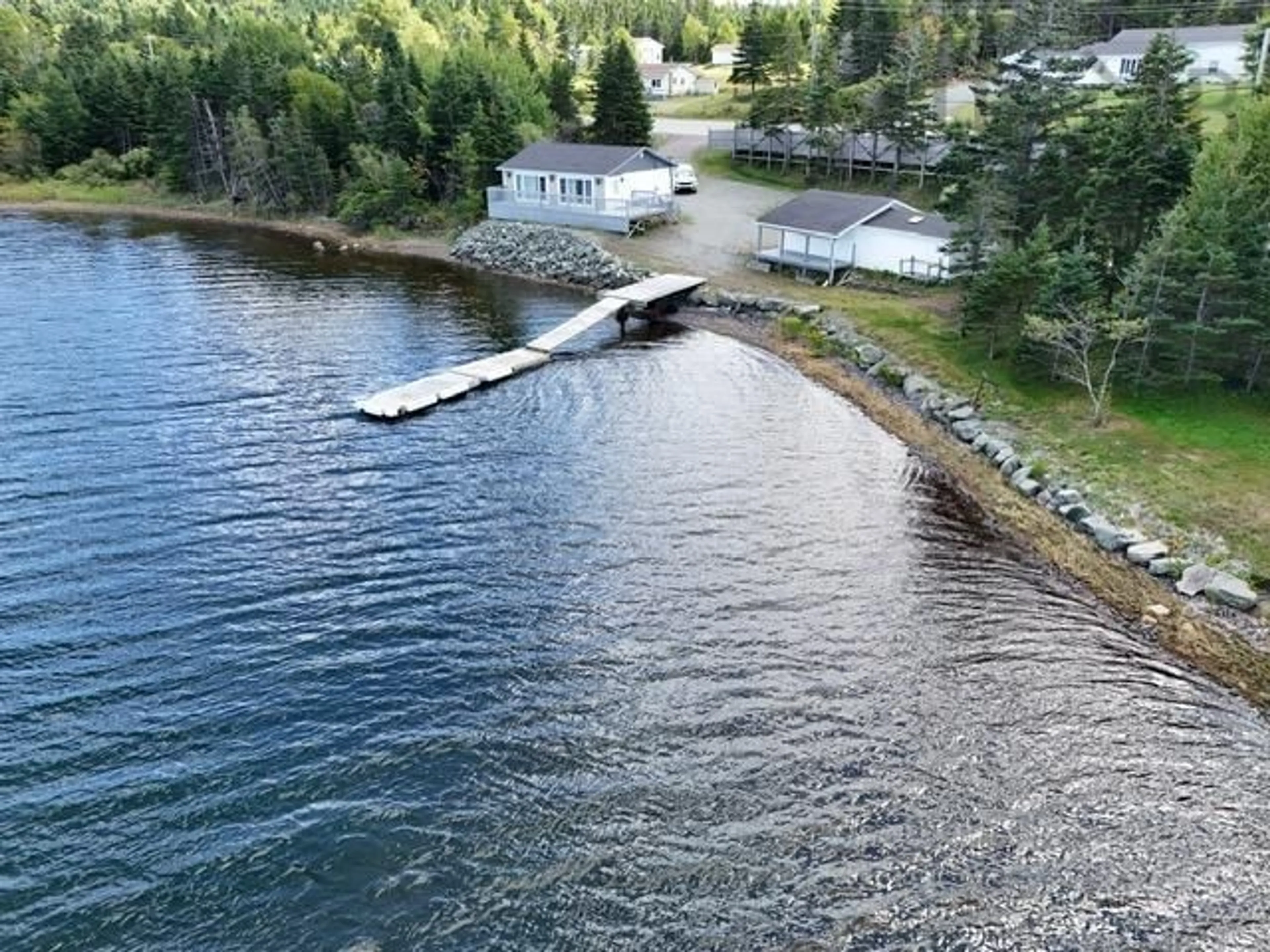 A pic from outside/outdoor area/front of a property/back of a property/a pic from drone, water/lake/river/ocean view for 10485 Grenville St, St. Peter's Nova Scotia B0E 3B0