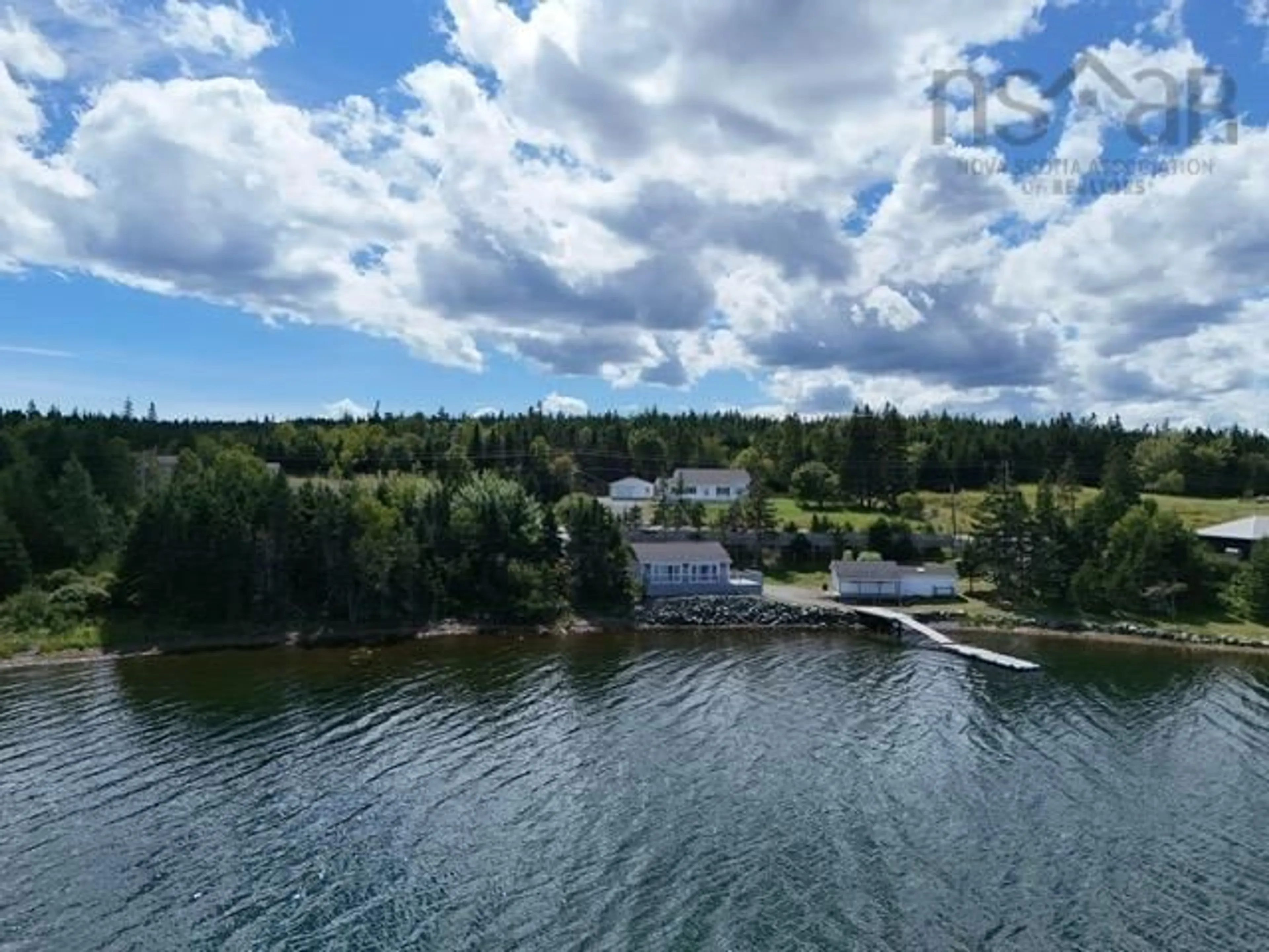 A pic from outside/outdoor area/front of a property/back of a property/a pic from drone, water/lake/river/ocean view for 10485 Grenville St, St. Peter's Nova Scotia B0E 3B0