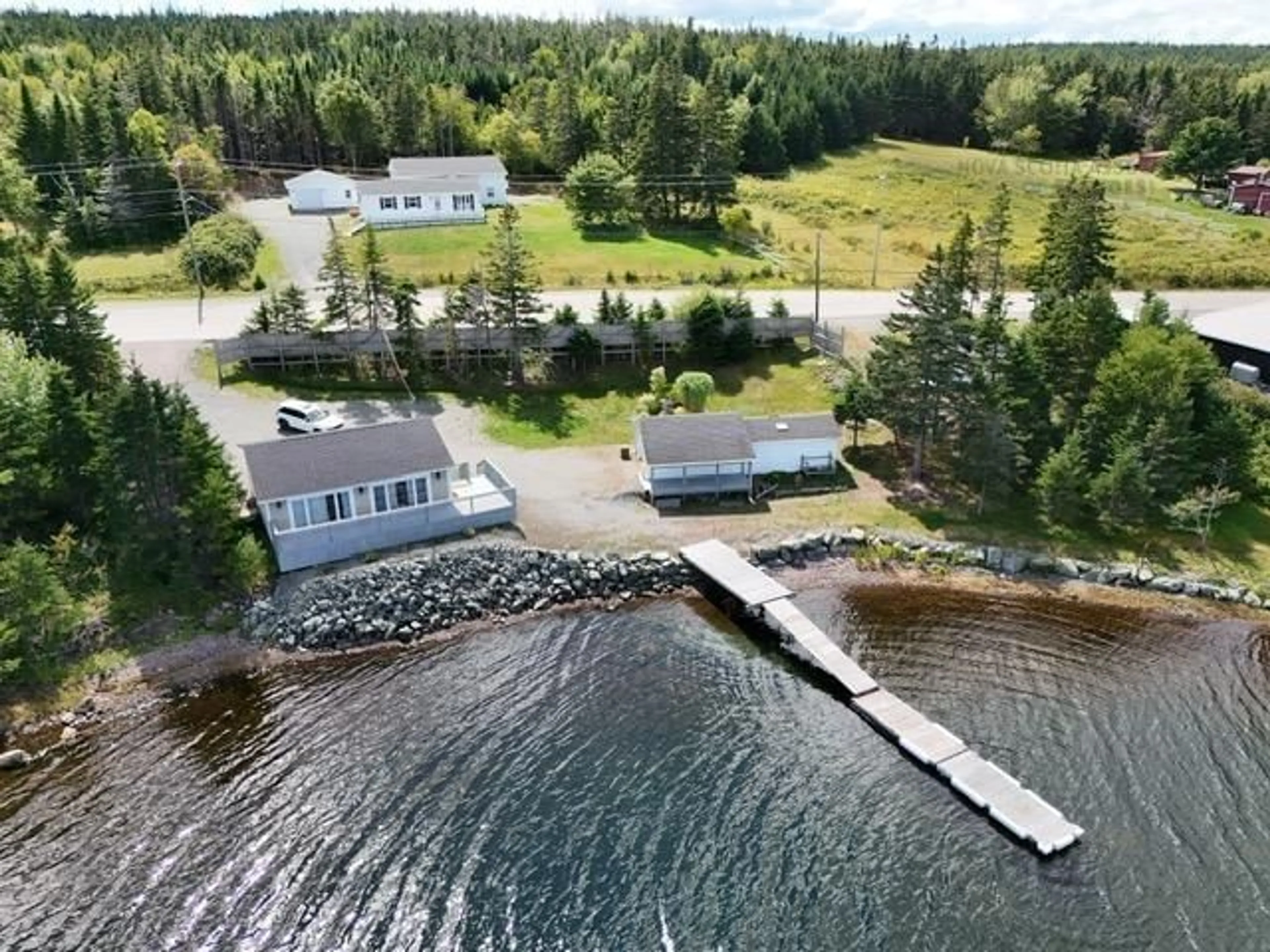 A pic from outside/outdoor area/front of a property/back of a property/a pic from drone, water/lake/river/ocean view for 10485 Grenville St, St. Peter's Nova Scotia B0E 3B0