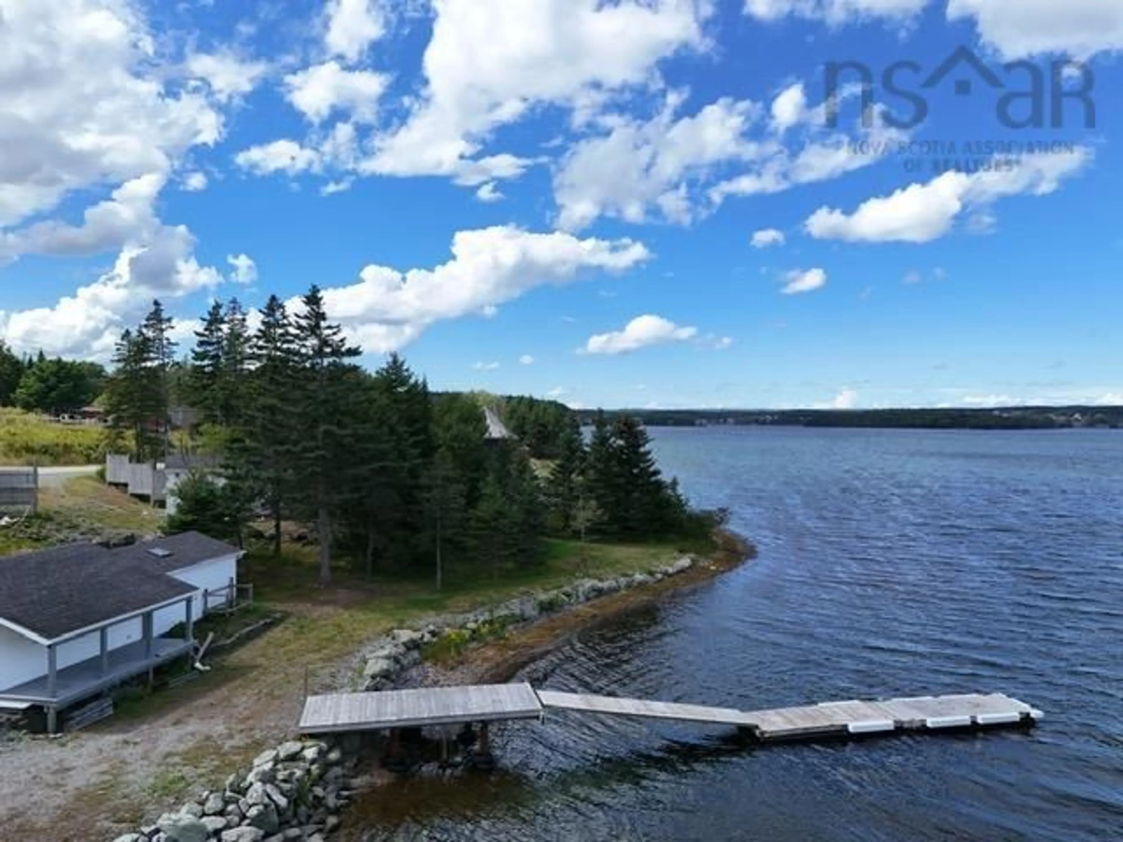 A pic from outside/outdoor area/front of a property/back of a property/a pic from drone, water/lake/river/ocean view for 10485 Grenville St, St. Peter's Nova Scotia B0E 3B0