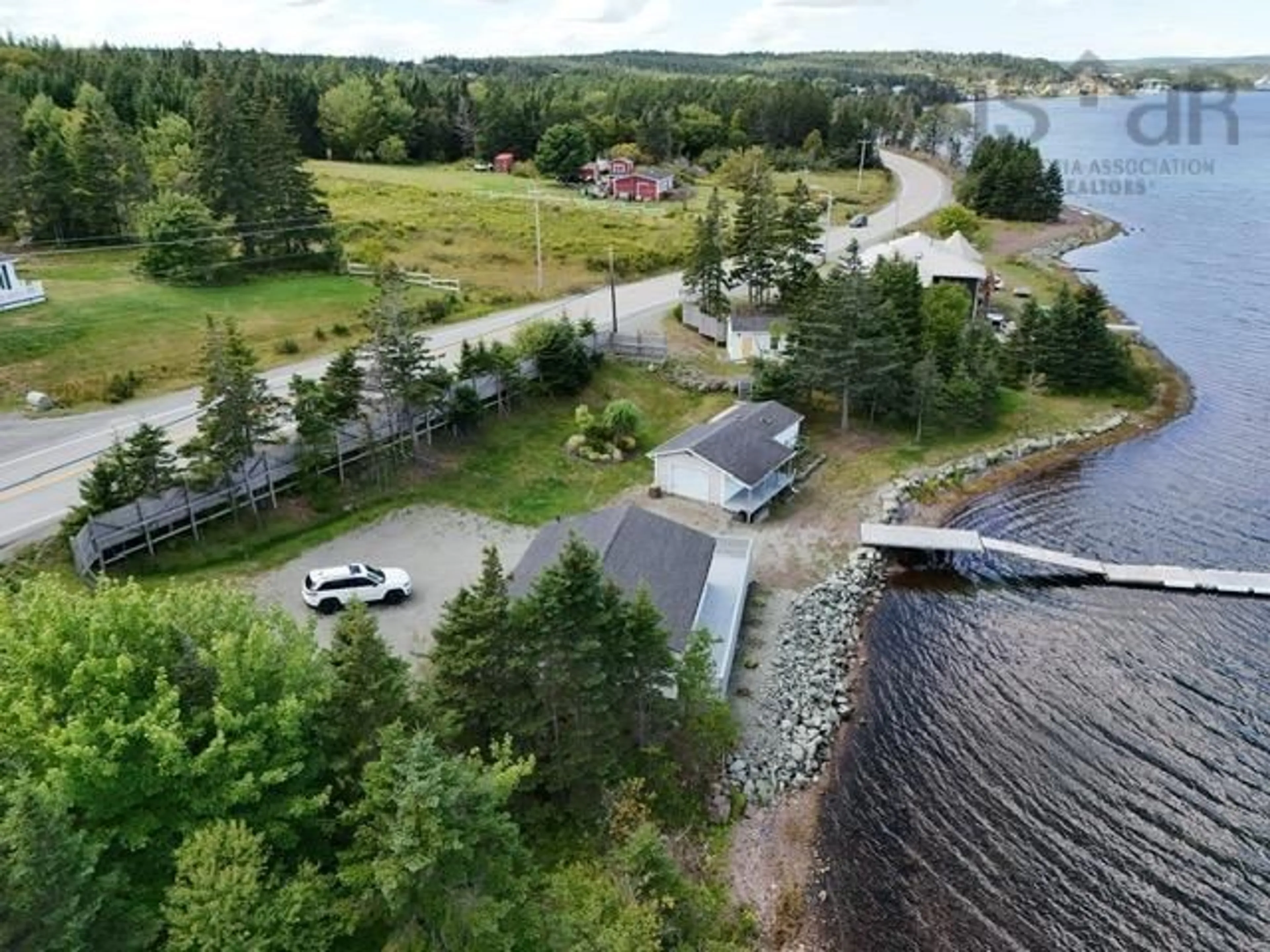 A pic from outside/outdoor area/front of a property/back of a property/a pic from drone, water/lake/river/ocean view for 10485 Grenville St, St. Peter's Nova Scotia B0E 3B0