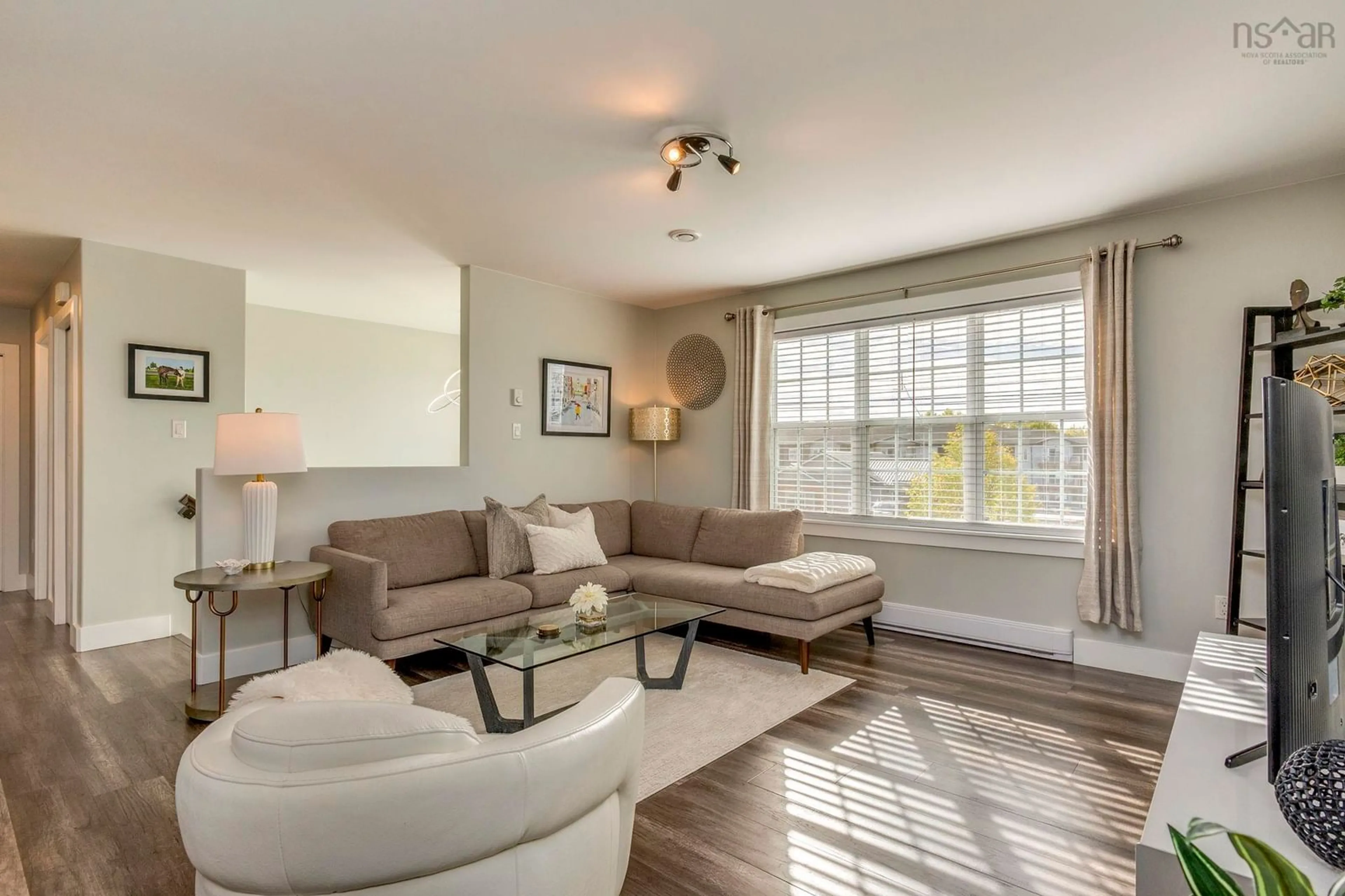 Living room with furniture, wood/laminate floor for 39 Ridge Ave, Stewiacke Nova Scotia B0N 2J0