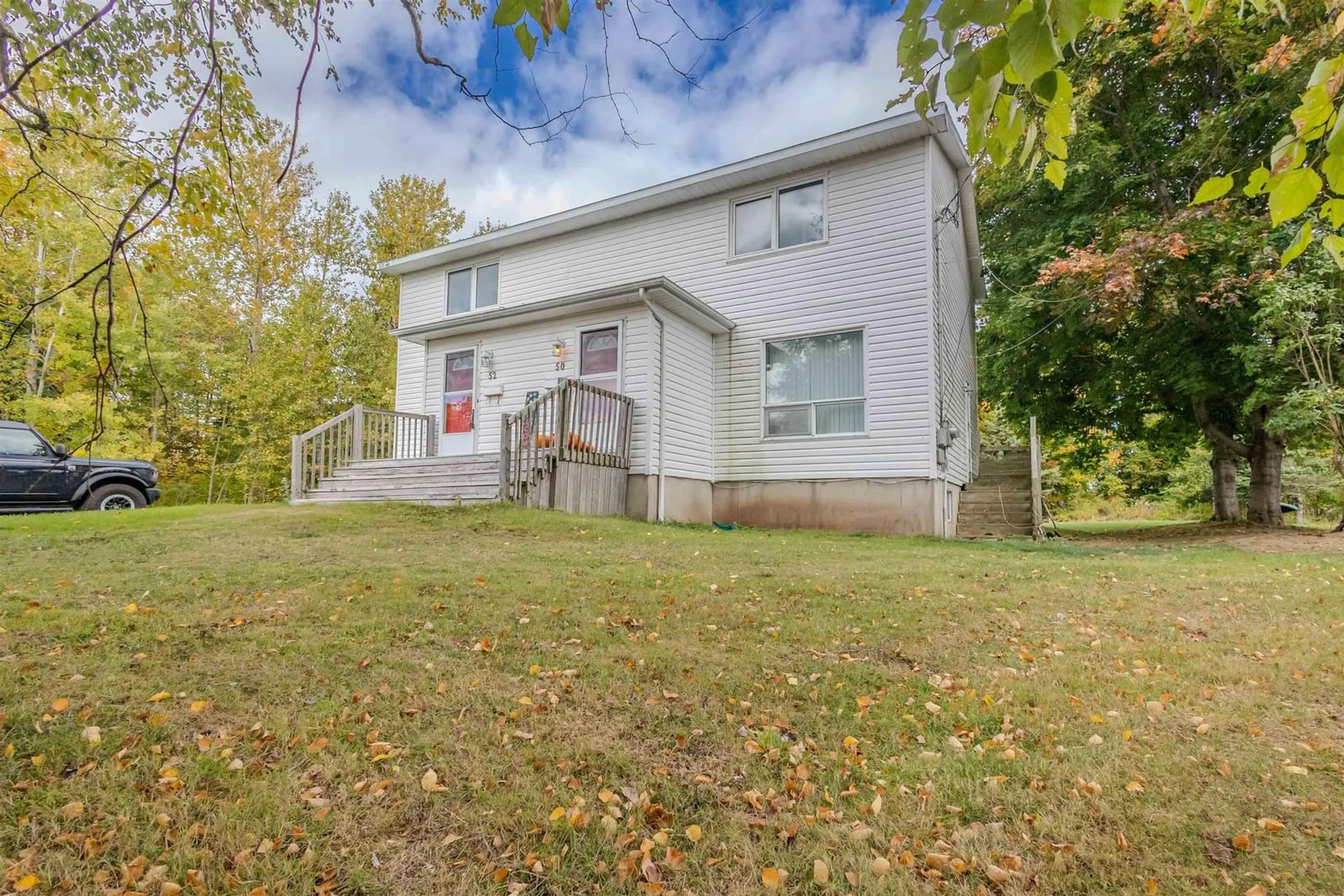 A pic from outside/outdoor area/front of a property/back of a property/a pic from drone, street for 50/52 Myrtle St, Westmount Nova Scotia B1L 1A7