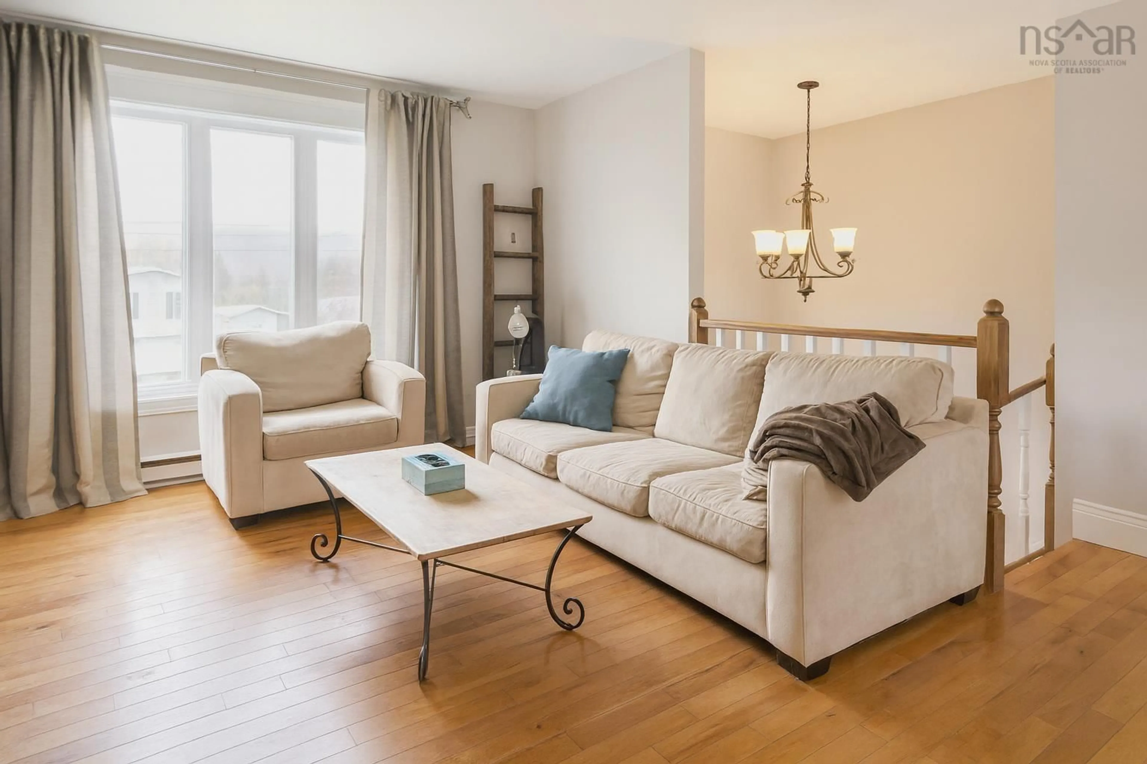 Living room with furniture, wood/laminate floor for 152 Doherty Dr, Lawrencetown Nova Scotia B2Z 1C8