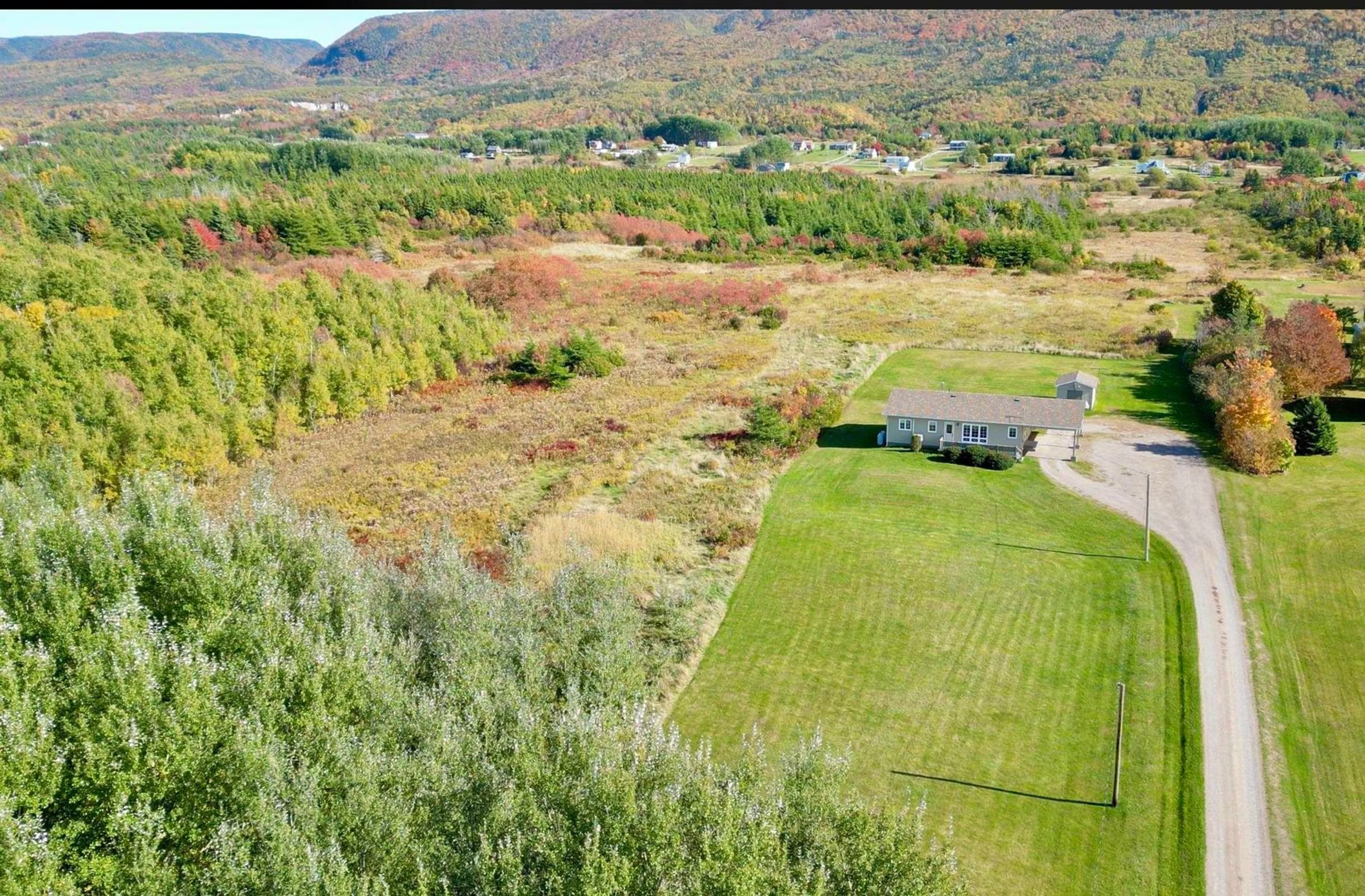 A pic from outside/outdoor area/front of a property/back of a property/a pic from drone, mountain view for 49 Barren Forks Rd, Chéticamp Nova Scotia B0E 1H0