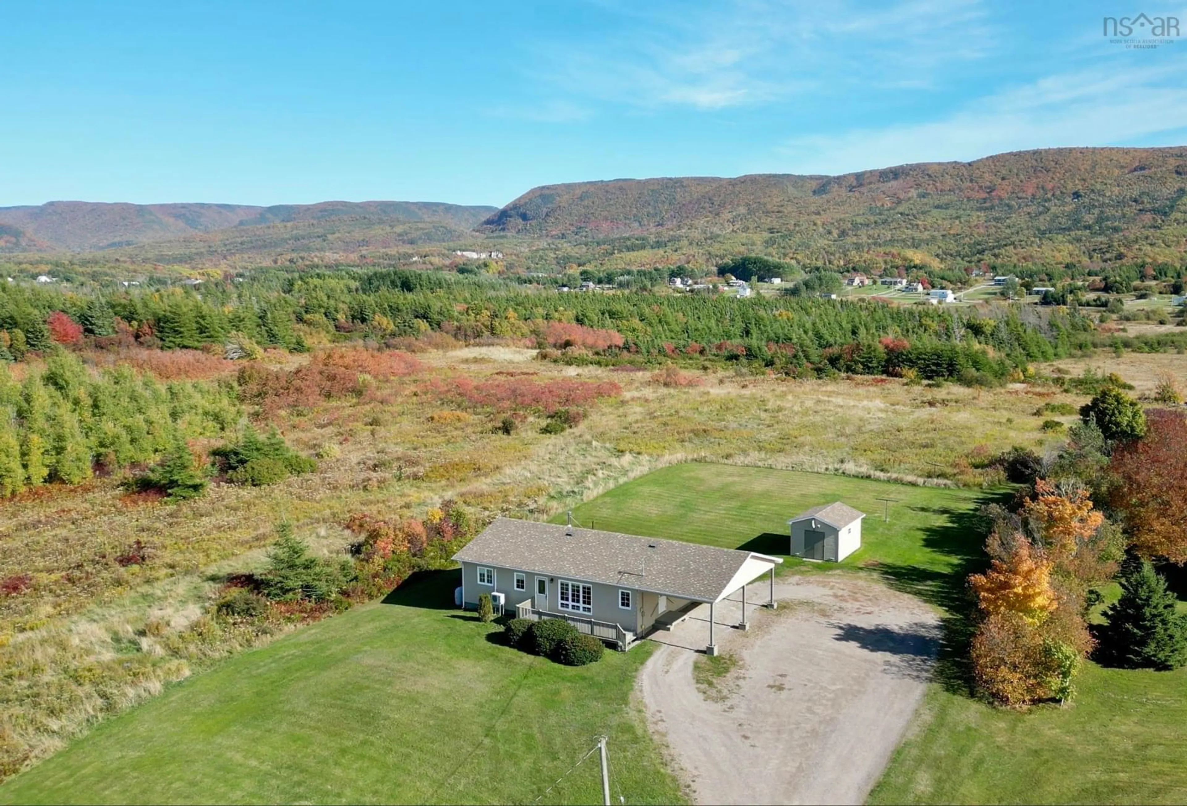 A pic from outside/outdoor area/front of a property/back of a property/a pic from drone, mountain view for 49 Barren Forks Rd, Chéticamp Nova Scotia B0E 1H0
