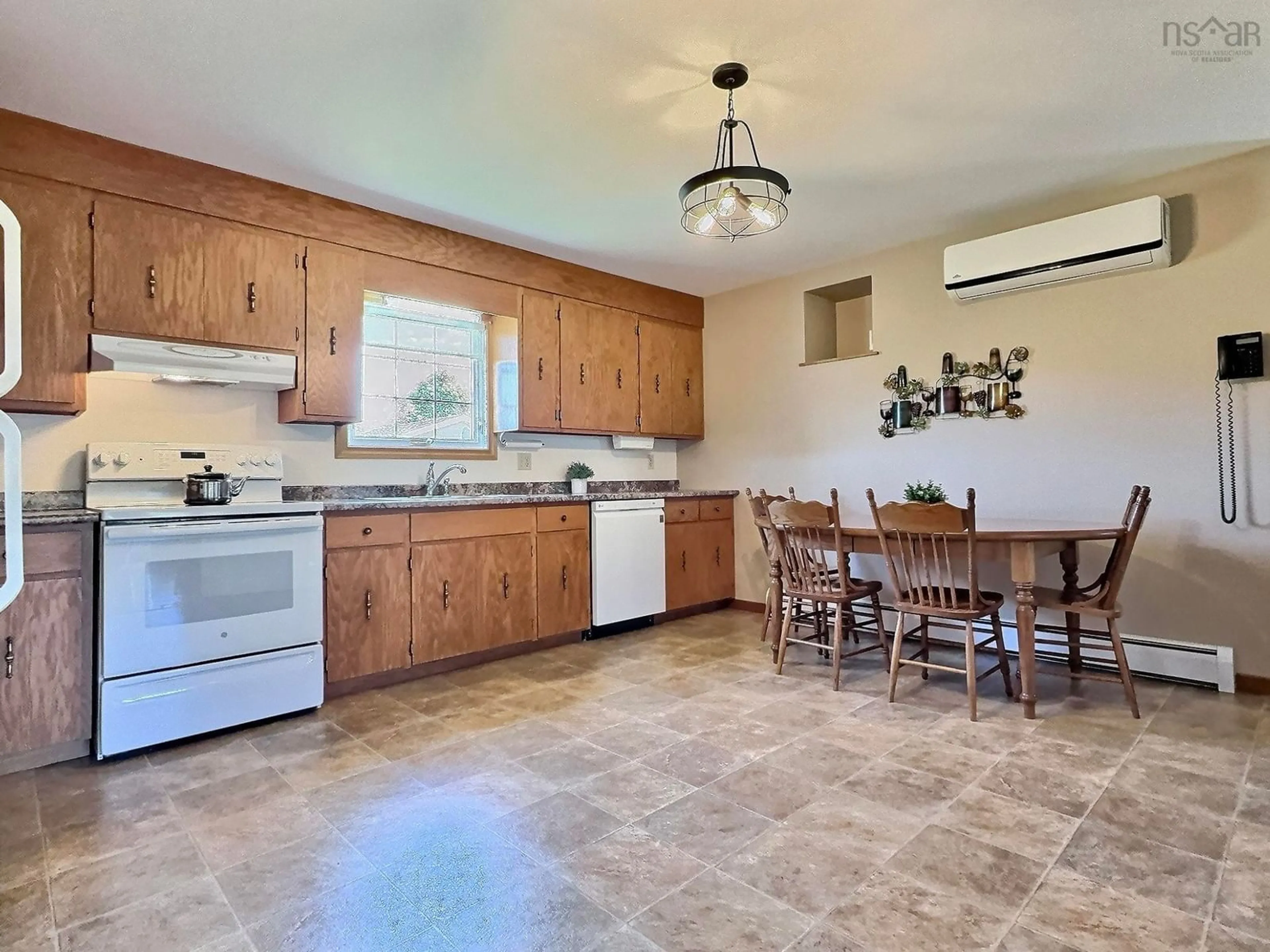 Open concept kitchen, ceramic/tile floor for 49 Barren Forks Rd, Chéticamp Nova Scotia B0E 1H0