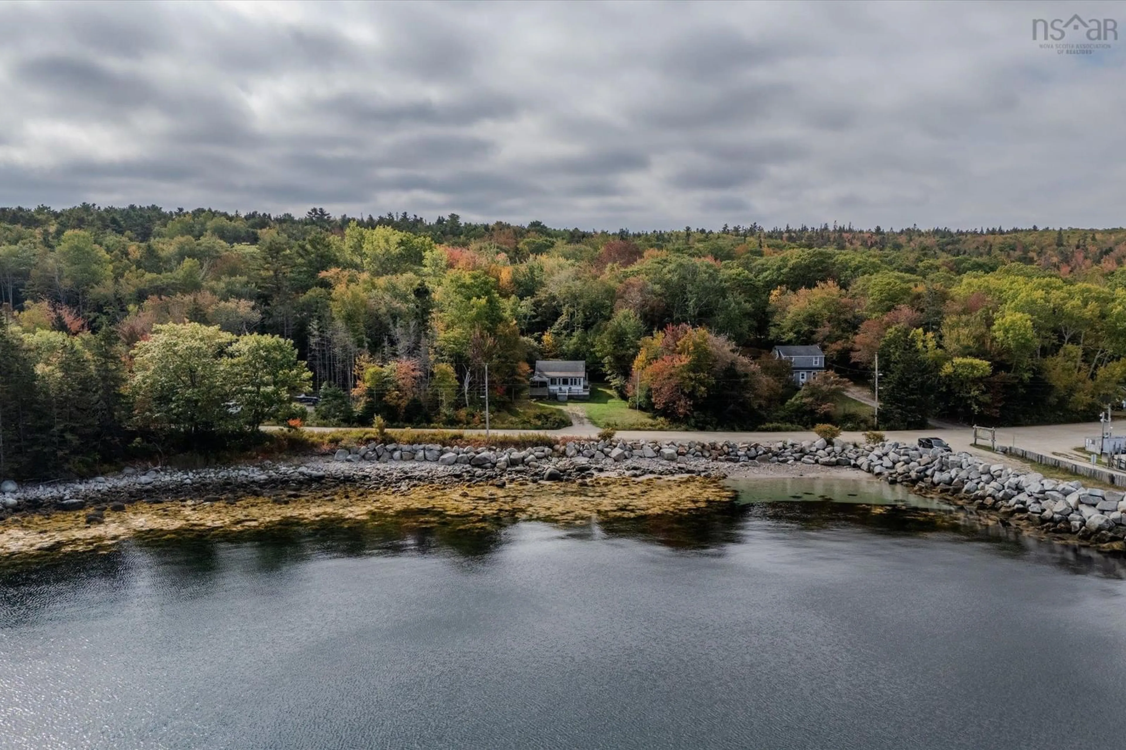 A pic from outside/outdoor area/front of a property/back of a property/a pic from drone, water/lake/river/ocean view for 348 Mill Cove Shore Rd, Mill Cove Nova Scotia B0J 1T0