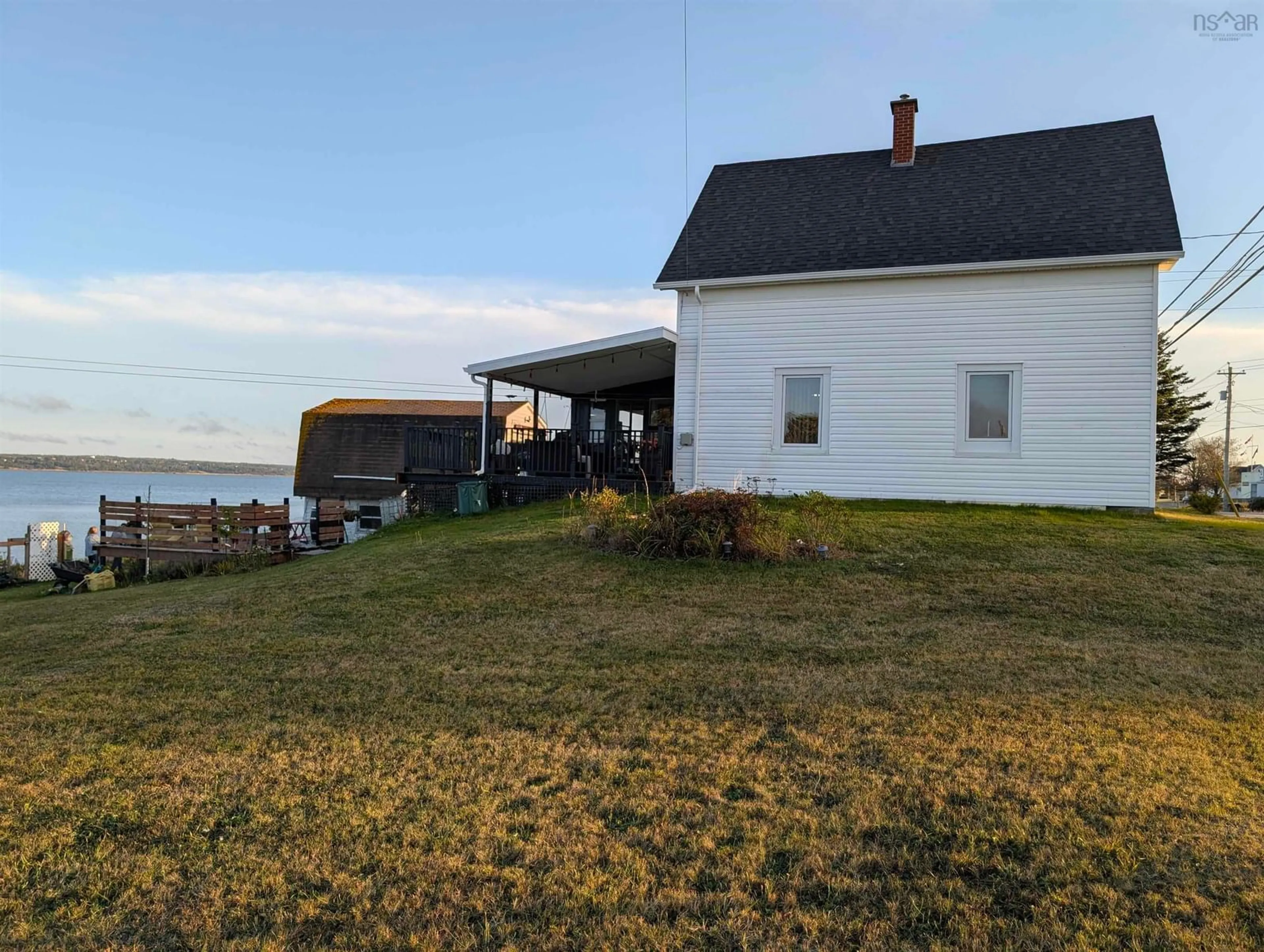 A pic from outside/outdoor area/front of a property/back of a property/a pic from drone, water/lake/river/ocean view for 637 Highway 335, West Pubnico Nova Scotia B0W 3S0