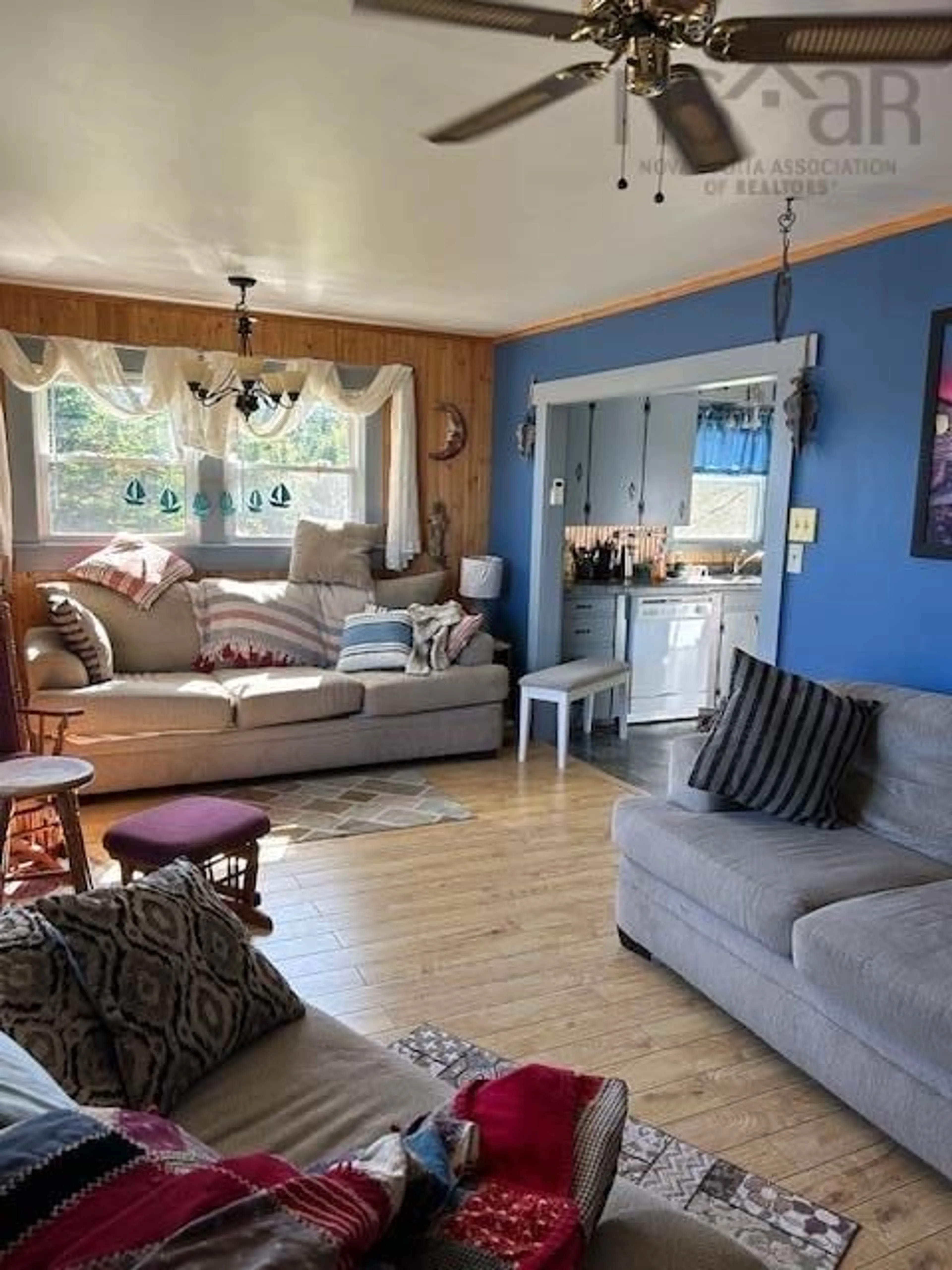 Living room with furniture, wood/laminate floor for 137 Brighton Rd, Lockeport Nova Scotia B0T 1W0