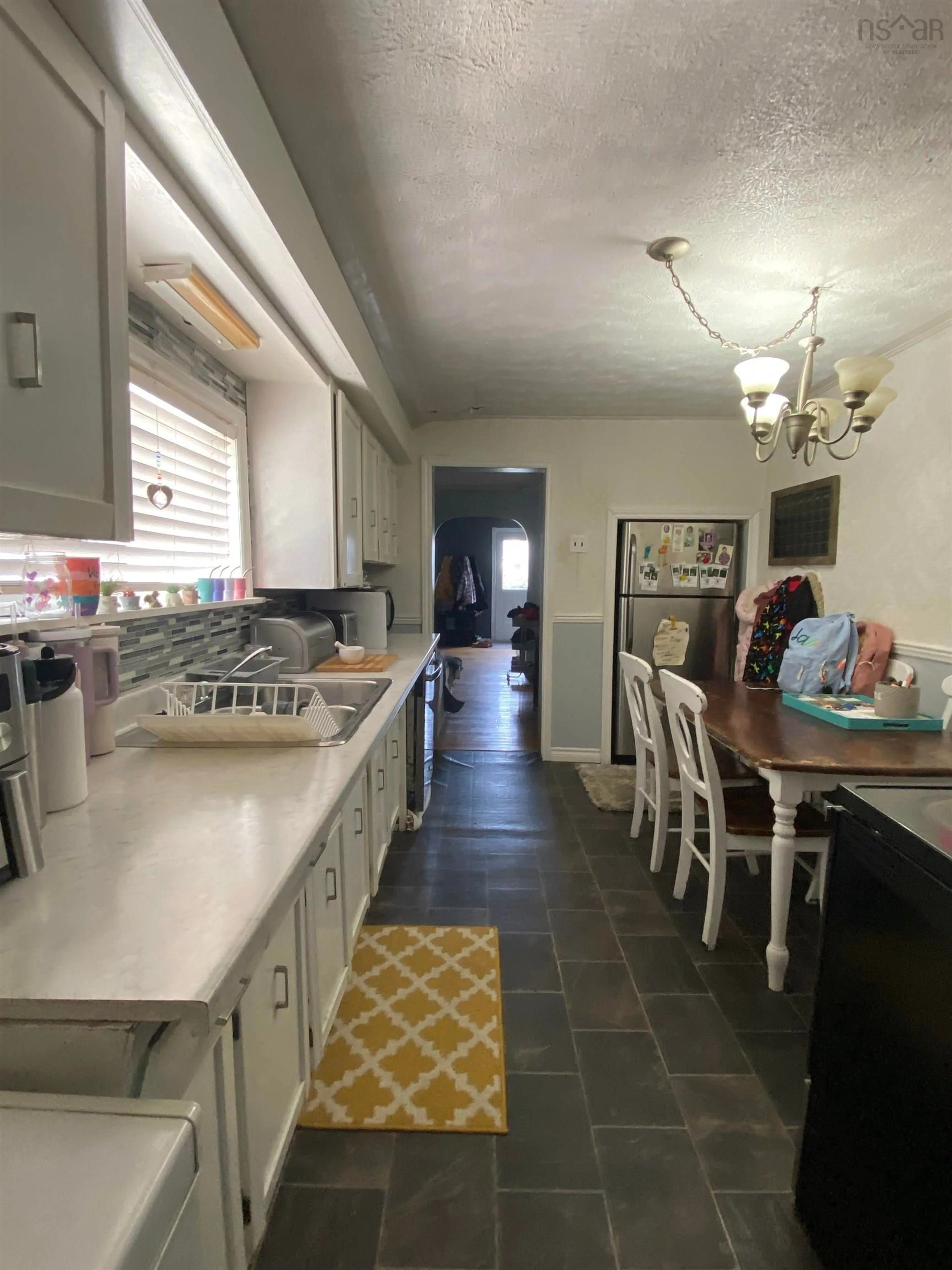 Open concept kitchen, ceramic/tile floor for 3452 Wilson Ave, New Waterford Nova Scotia B1H 1W9