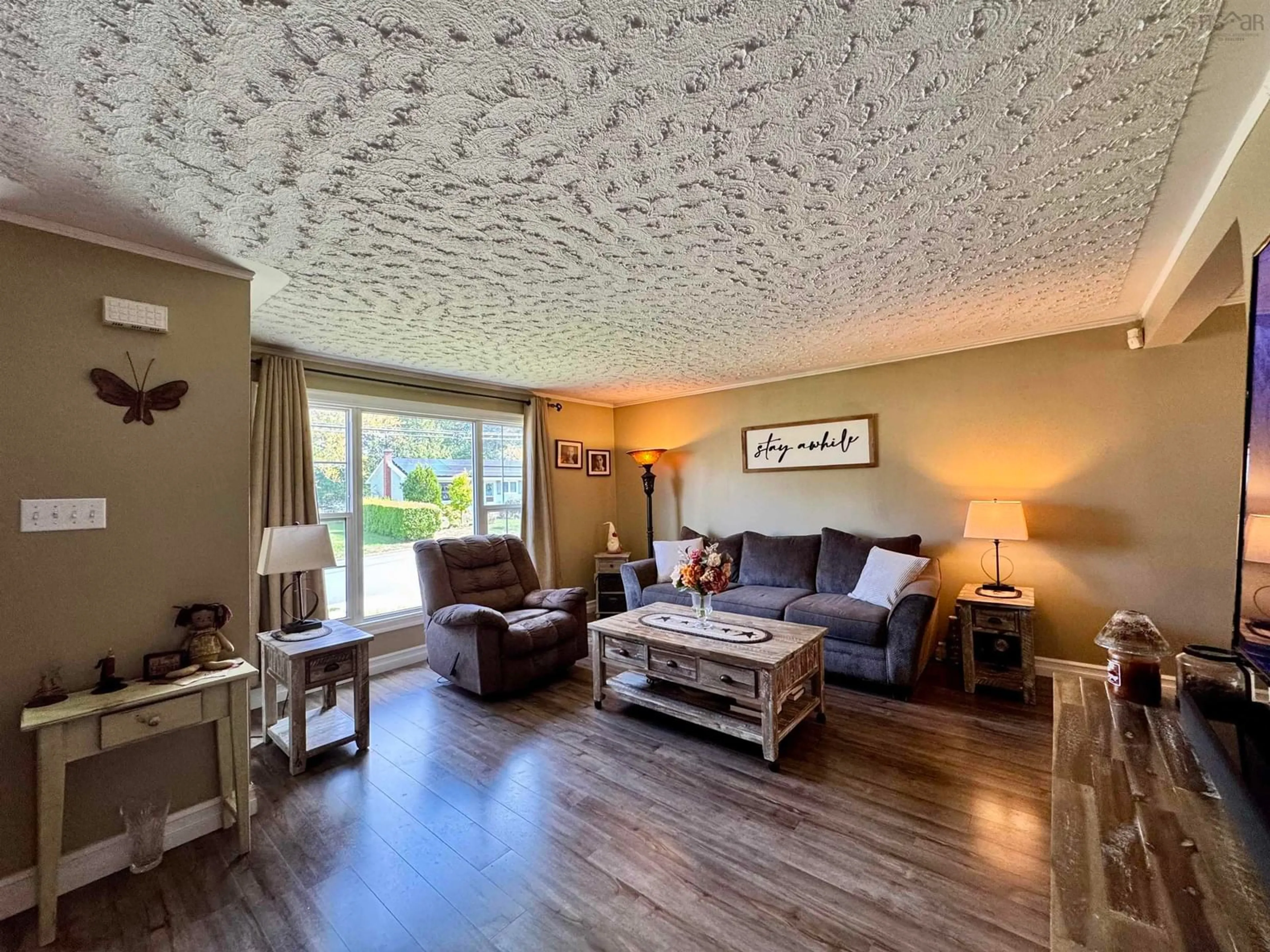 Living room with furniture, wood/laminate floor for 214 Stokil Dr, Lower Sackville Nova Scotia B4C 3C3