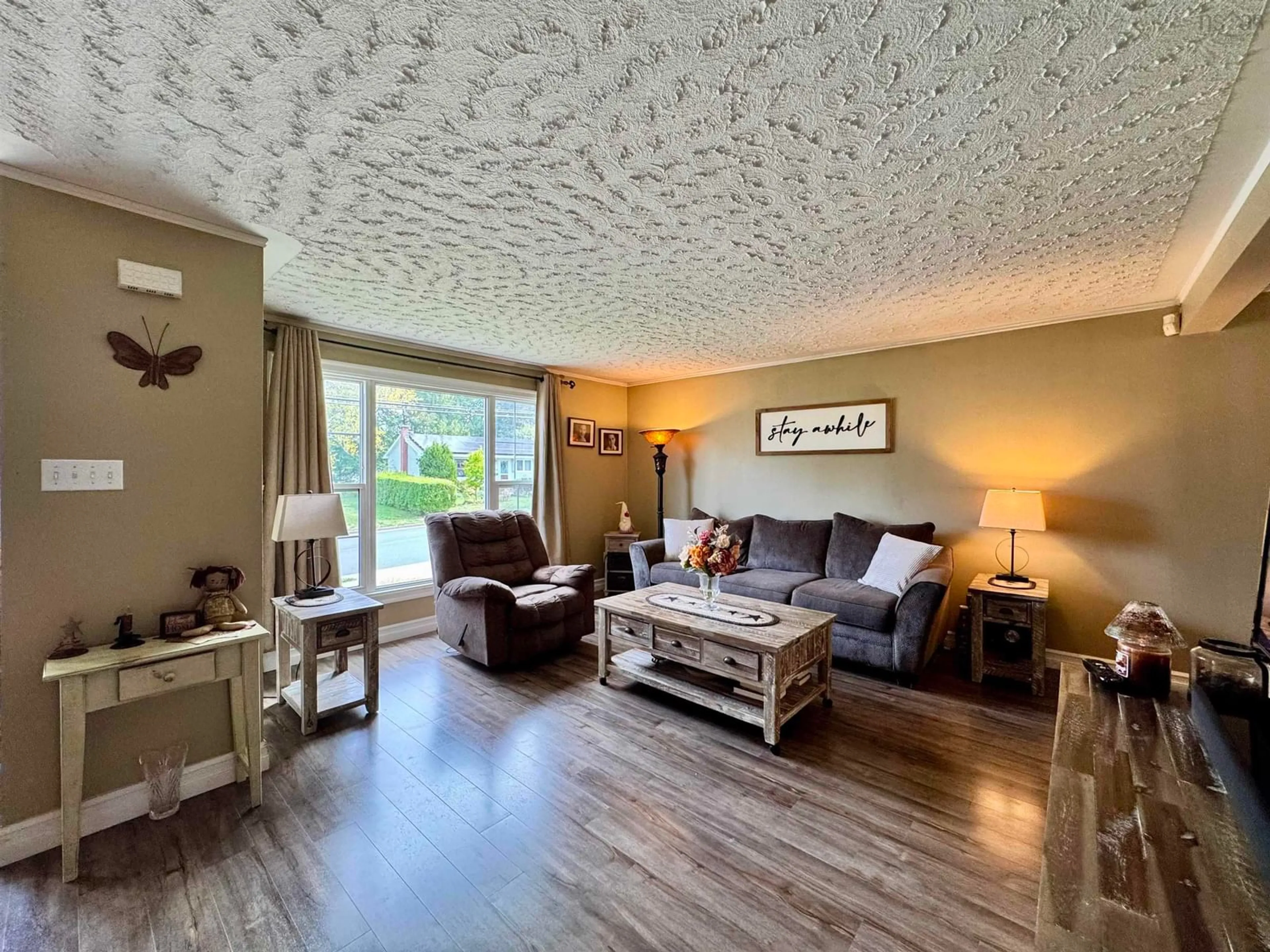 Living room with furniture, wood/laminate floor for 214 Stokil Dr, Lower Sackville Nova Scotia B4C 3C3