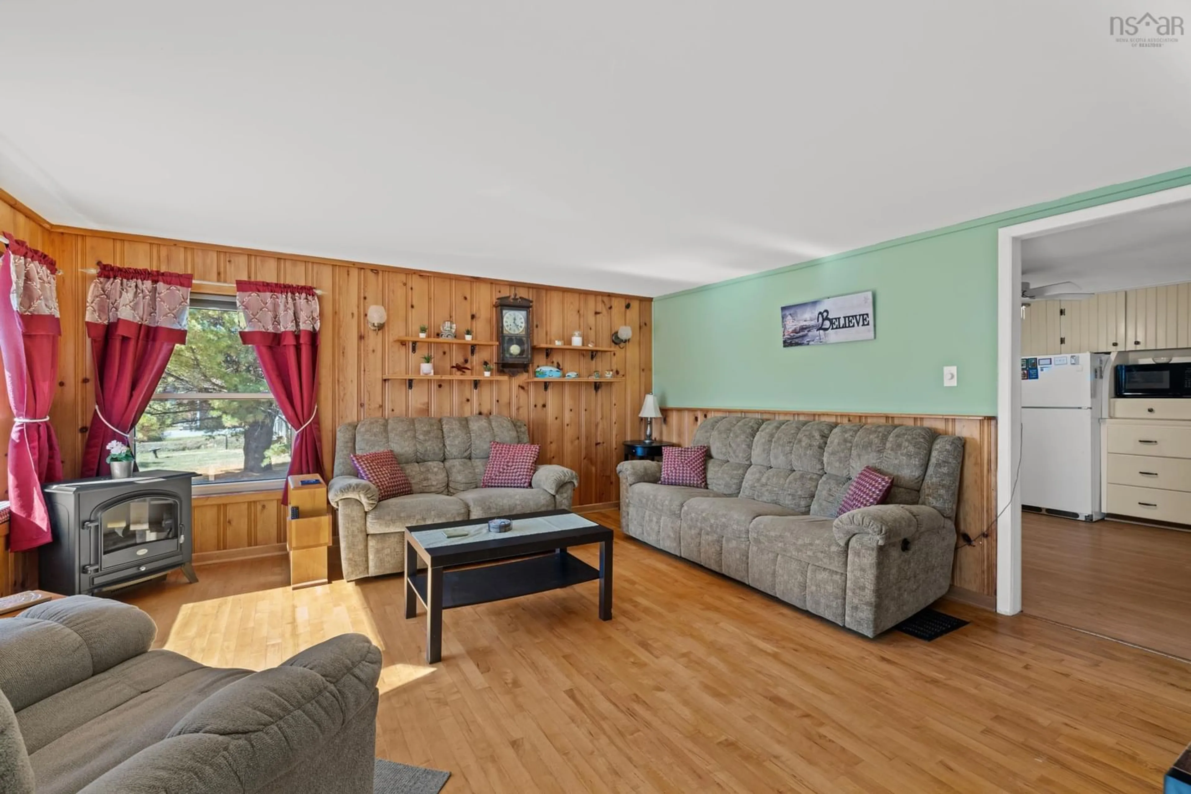 Living room with furniture, wood/laminate floor for 15 Zinck Rd, Chester Nova Scotia B0J 1J0
