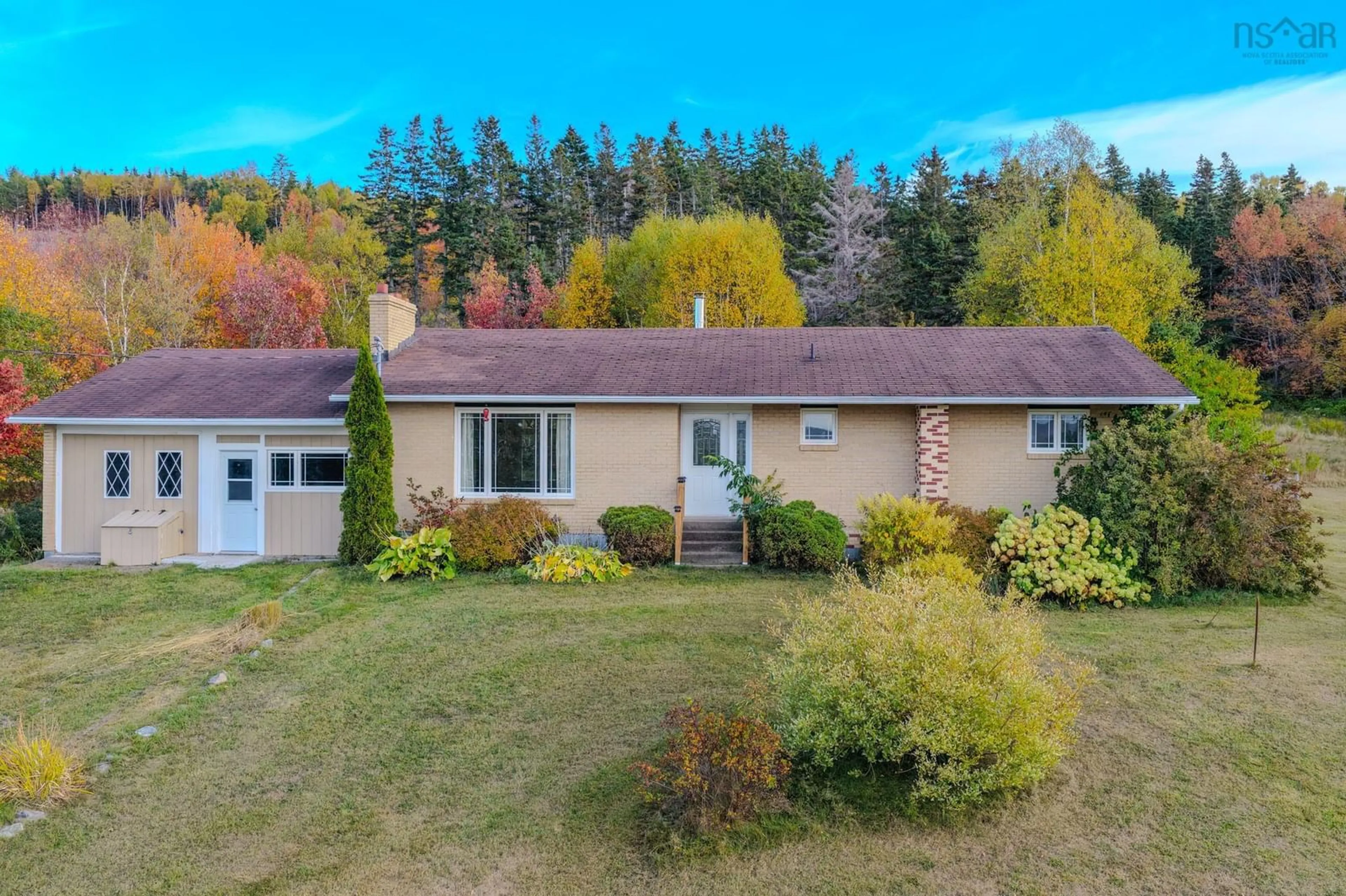 A pic from outside/outdoor area/front of a property/back of a property/a pic from drone, unknown for 7587 East Bay Hwy, Big Pond Nova Scotia B1J 1Y8