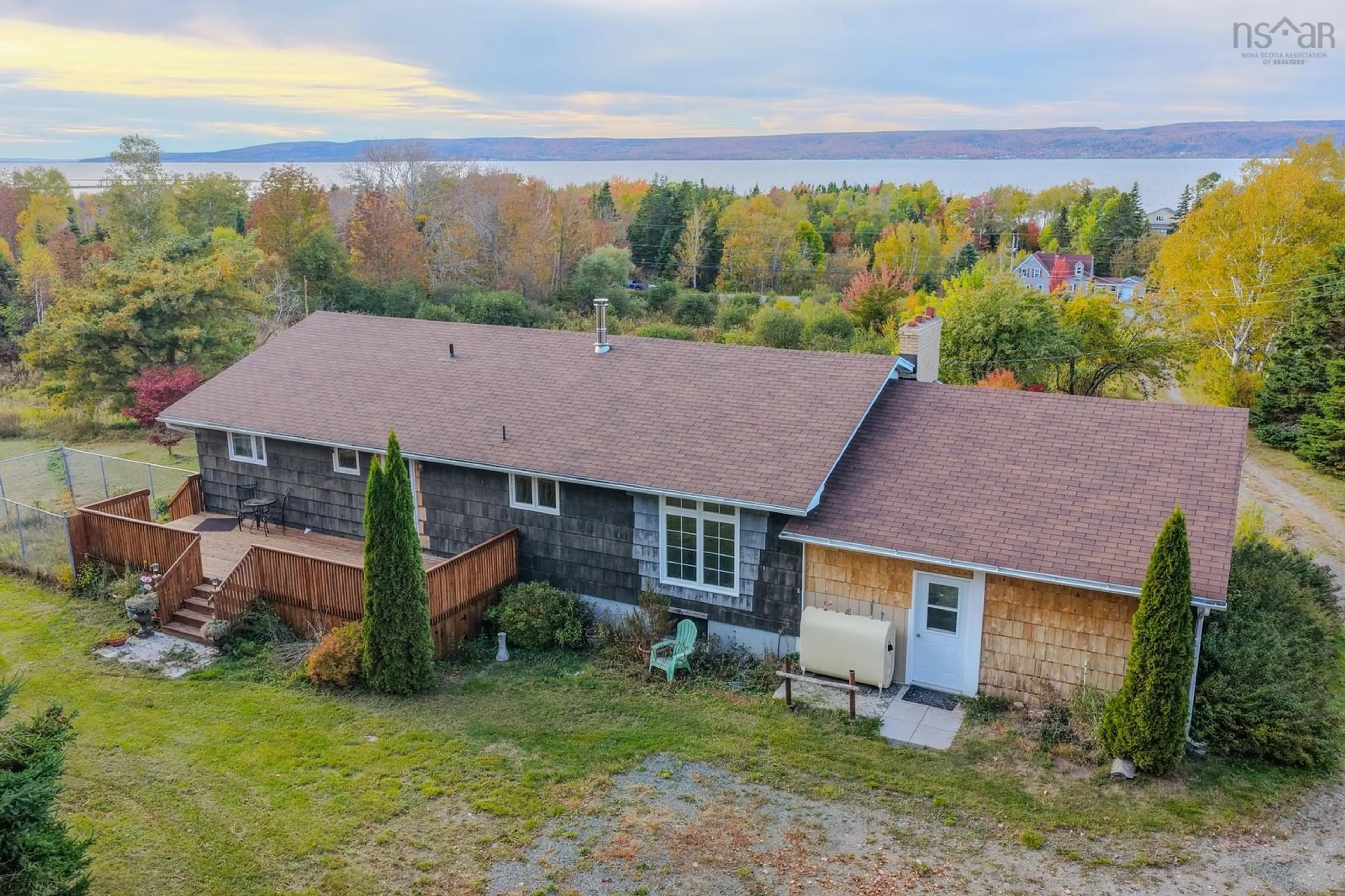 A pic from outside/outdoor area/front of a property/back of a property/a pic from drone, water/lake/river/ocean view for 7587 East Bay Hwy, Big Pond Nova Scotia B1J 1Y8