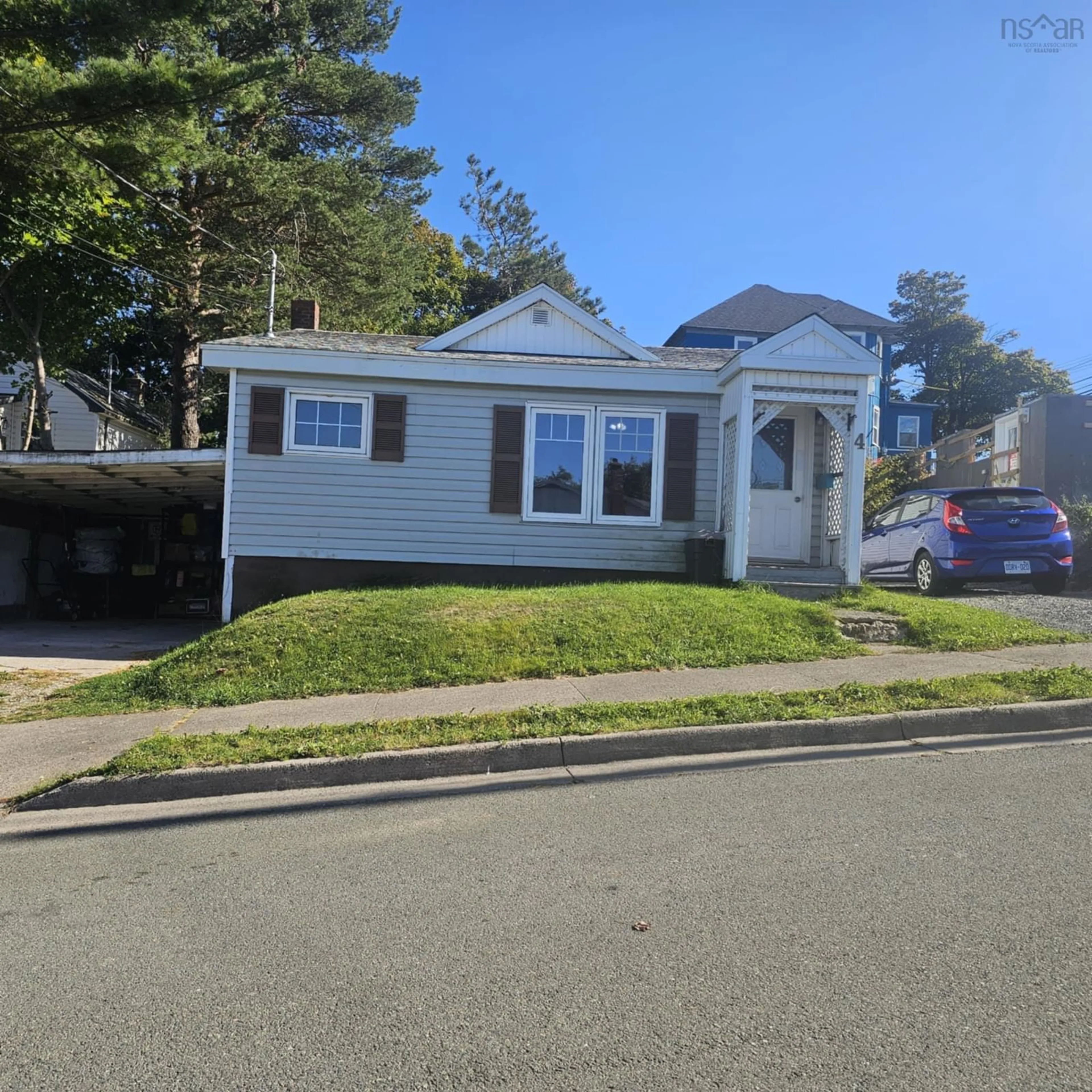 Home with vinyl exterior material, street for 4 Spring St, Sydney Nova Scotia B1P 3P2