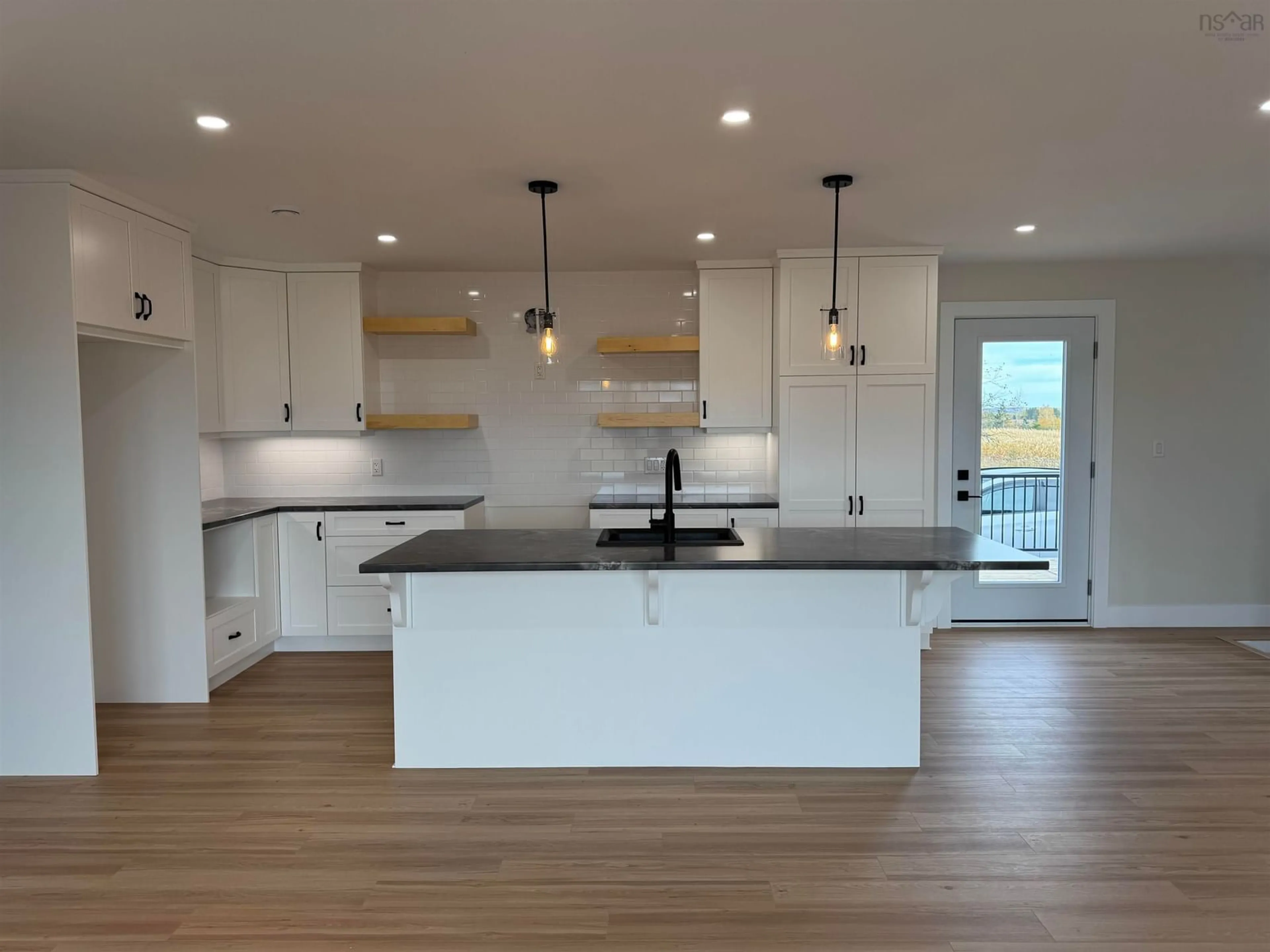 Open concept kitchen, wood/laminate floor for 51 Five Point Rd, Lower Debert Nova Scotia B0M 1G0