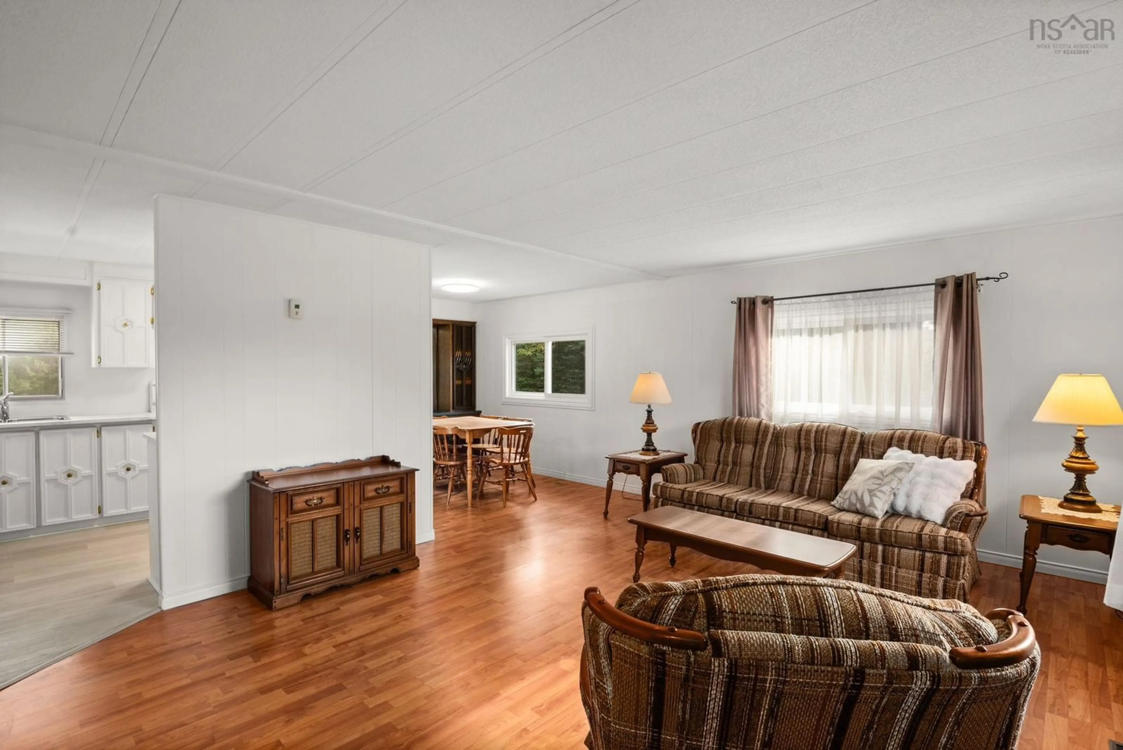 Living room with furniture, wood/laminate floor for 24 Moore Dr, Lawrencetown Nova Scotia B2Z 1R2