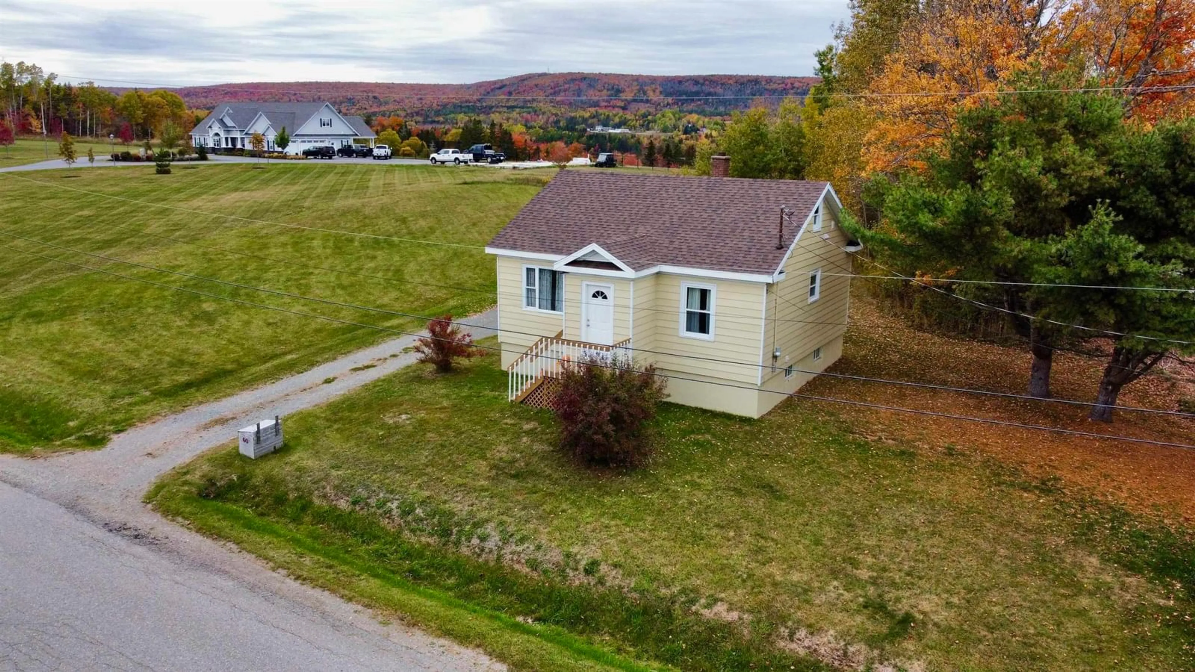 A pic from outside/outdoor area/front of a property/back of a property/a pic from drone, unknown for 60 Crestdale Dr, Sydney Forks Nova Scotia B1L 1A1