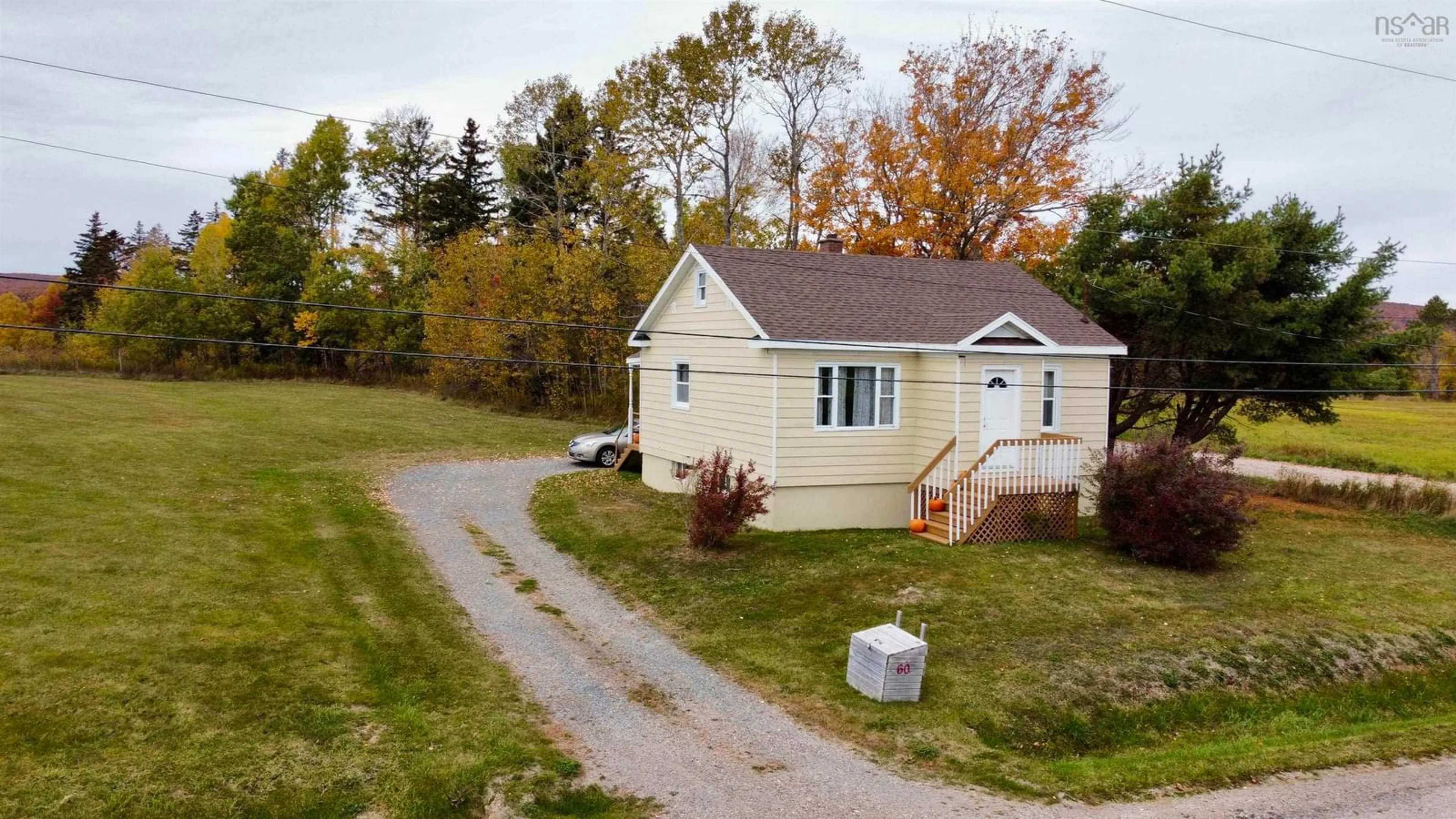 A pic from outside/outdoor area/front of a property/back of a property/a pic from drone, street for 60 Crestdale Dr, Sydney Forks Nova Scotia B1L 1A1