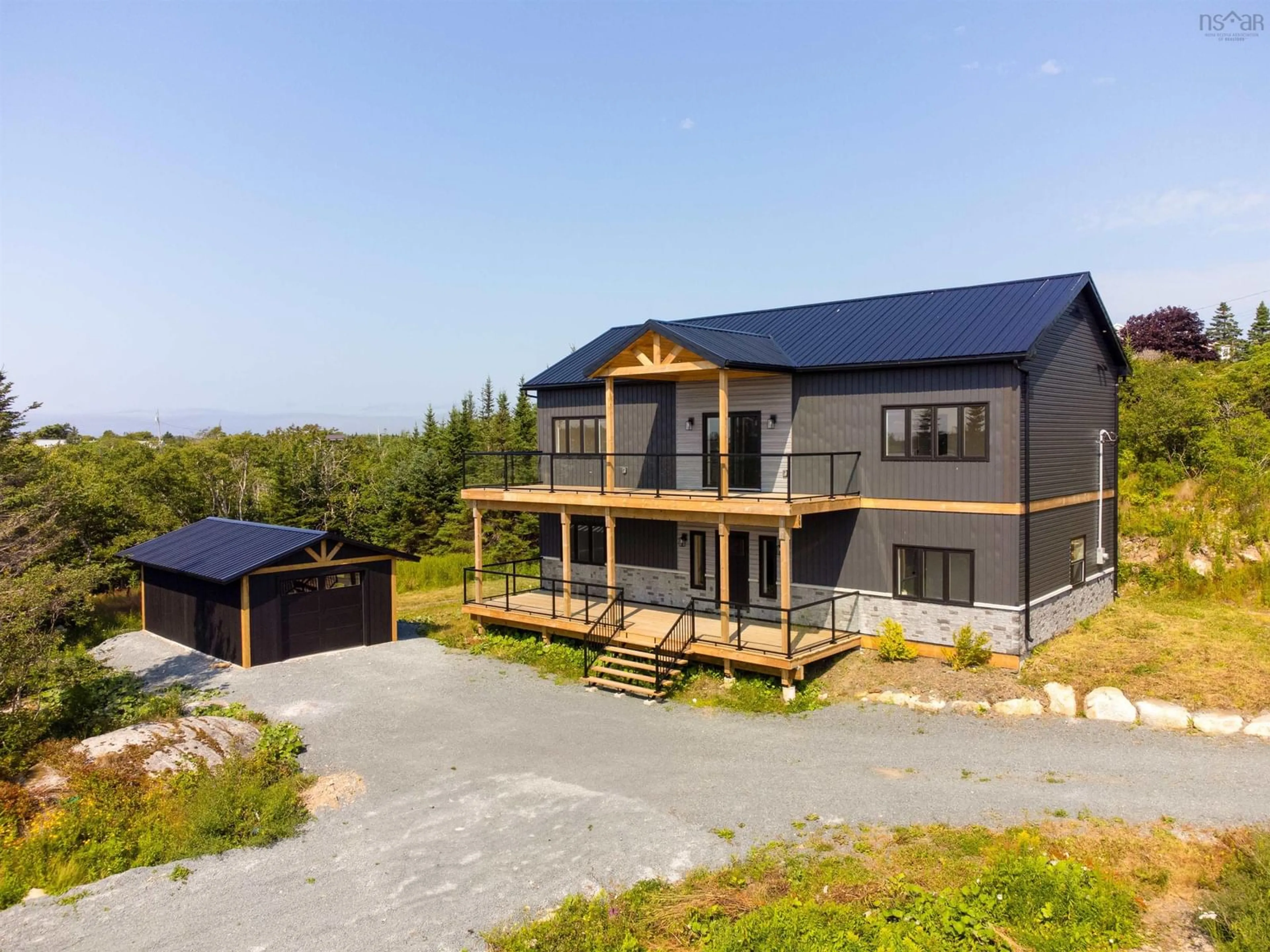 A pic from outside/outdoor area/front of a property/back of a property/a pic from drone, unknown for 1605 Terence Bay Rd, Terence Bay Nova Scotia B3T 1X9