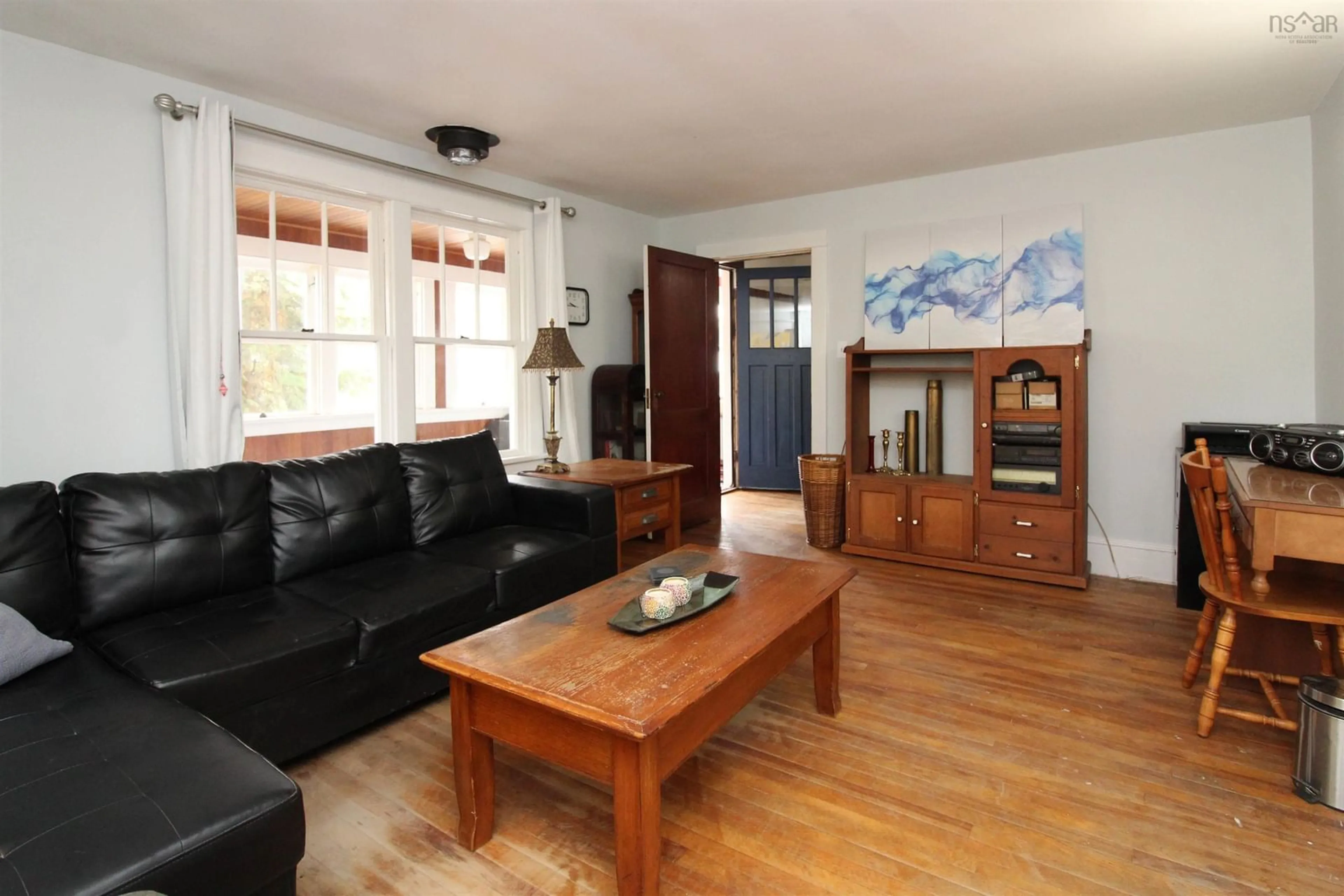 Living room with furniture, wood/laminate floor for 8 Belgrave Terr, Truro Nova Scotia B2N 2G4