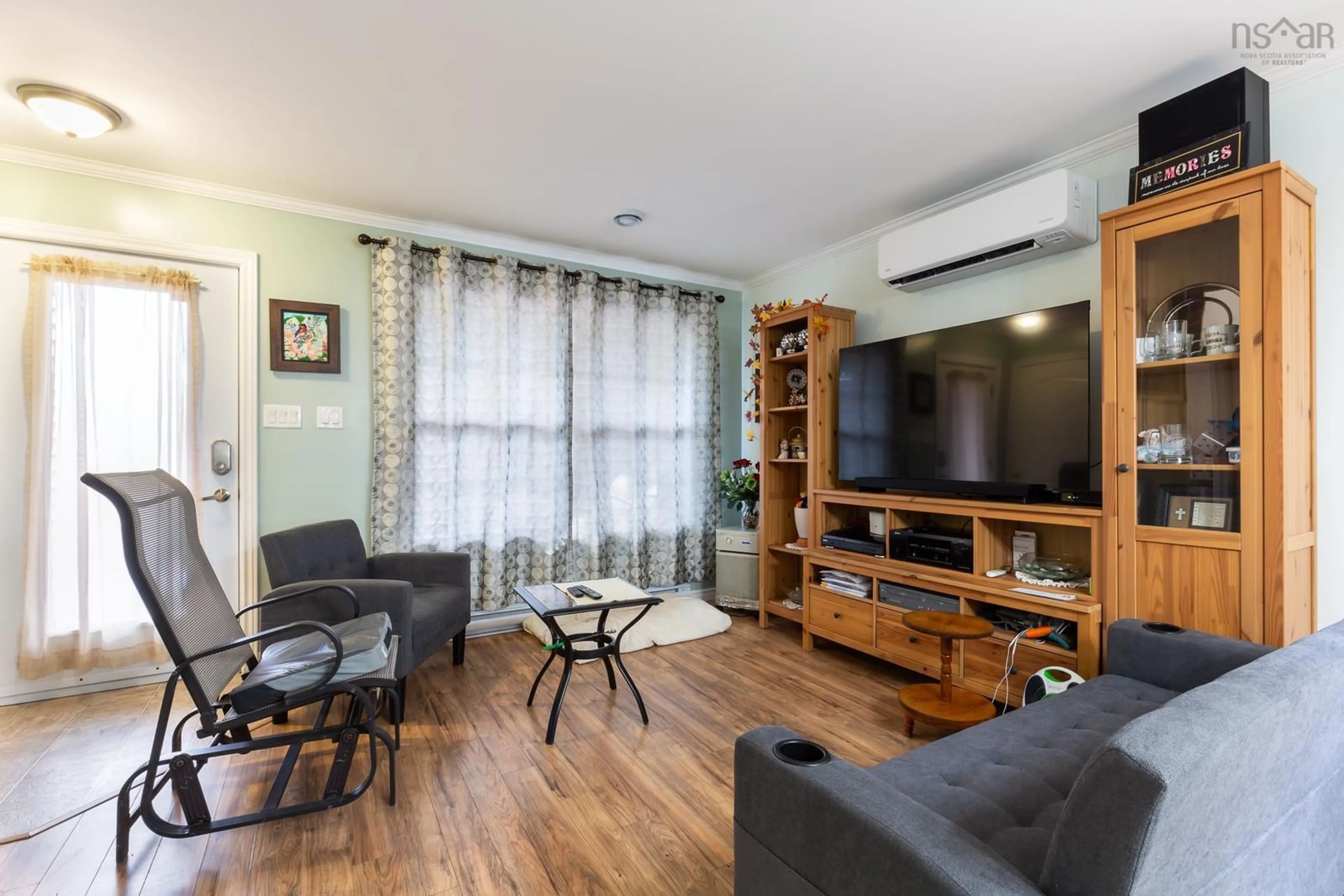 Living room with furniture, wood/laminate floor for 60 Old Deepdale Rd, Inverness Nova Scotia B0E 1N0