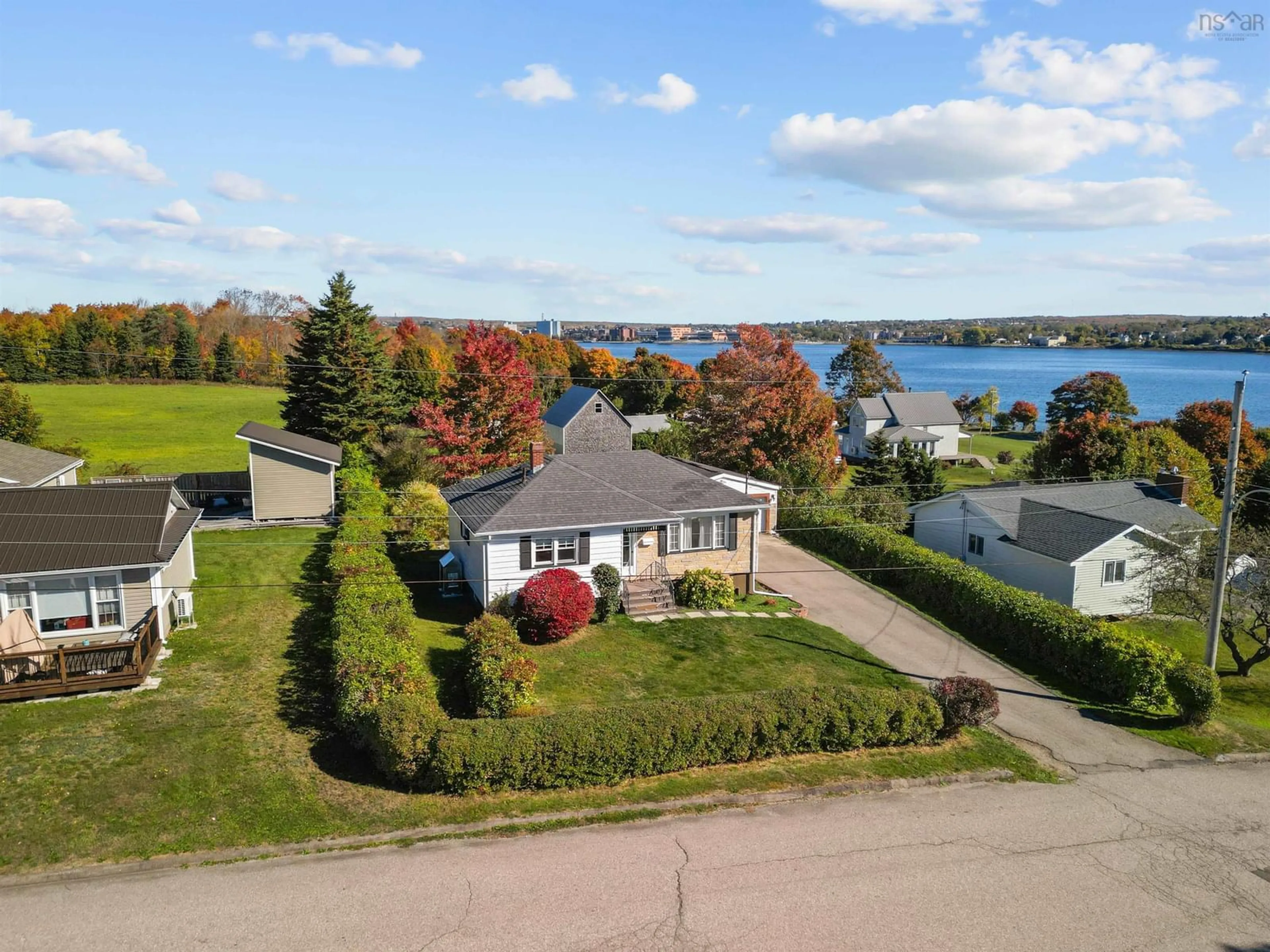 A pic from outside/outdoor area/front of a property/back of a property/a pic from drone, water/lake/river/ocean view for 38 Melwood Dr, Westmount Nova Scotia B1R 1W2