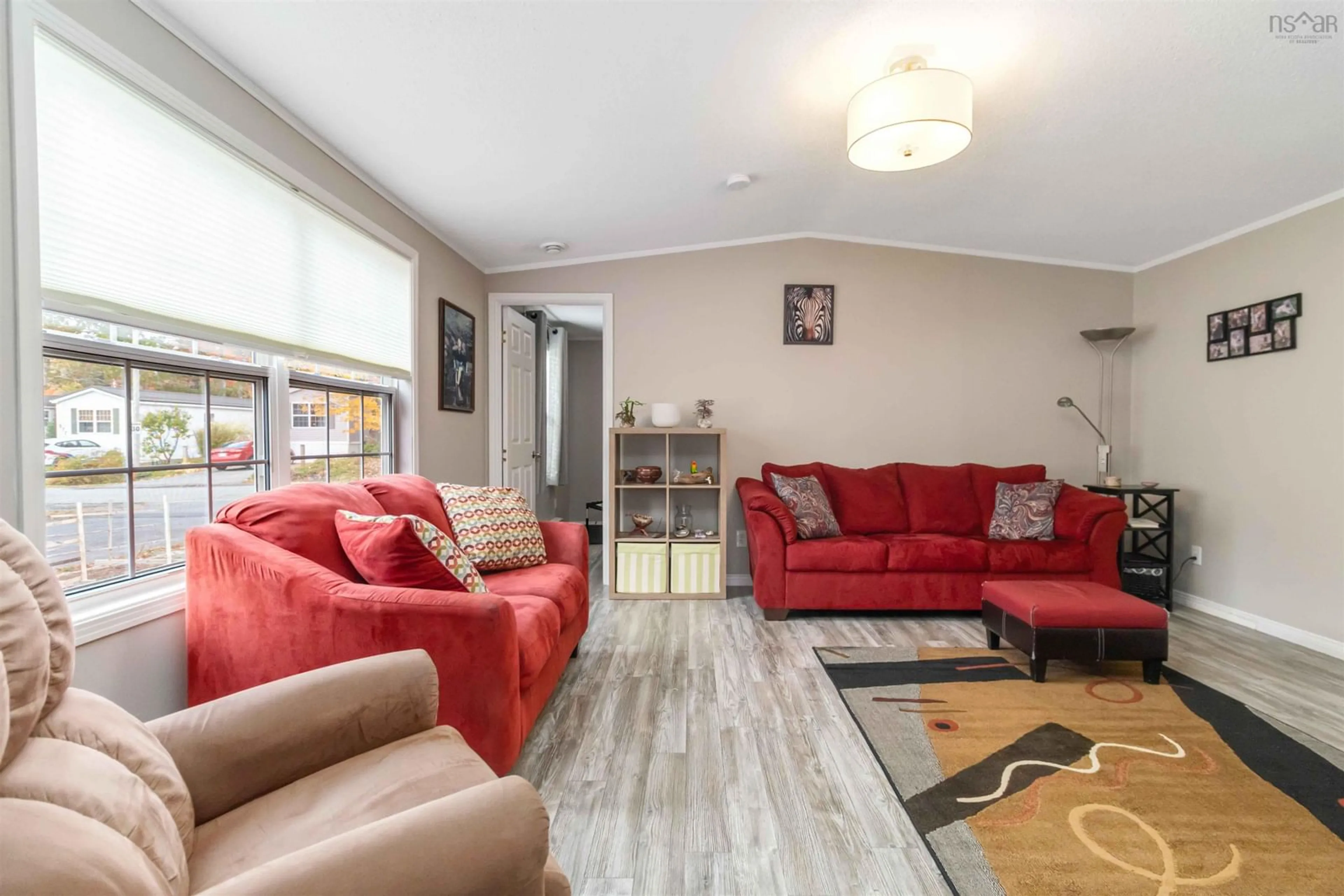 Living room with furniture, wood/laminate floor for 400 Seasons Dr, Bridgewater Nova Scotia B4N 4C1