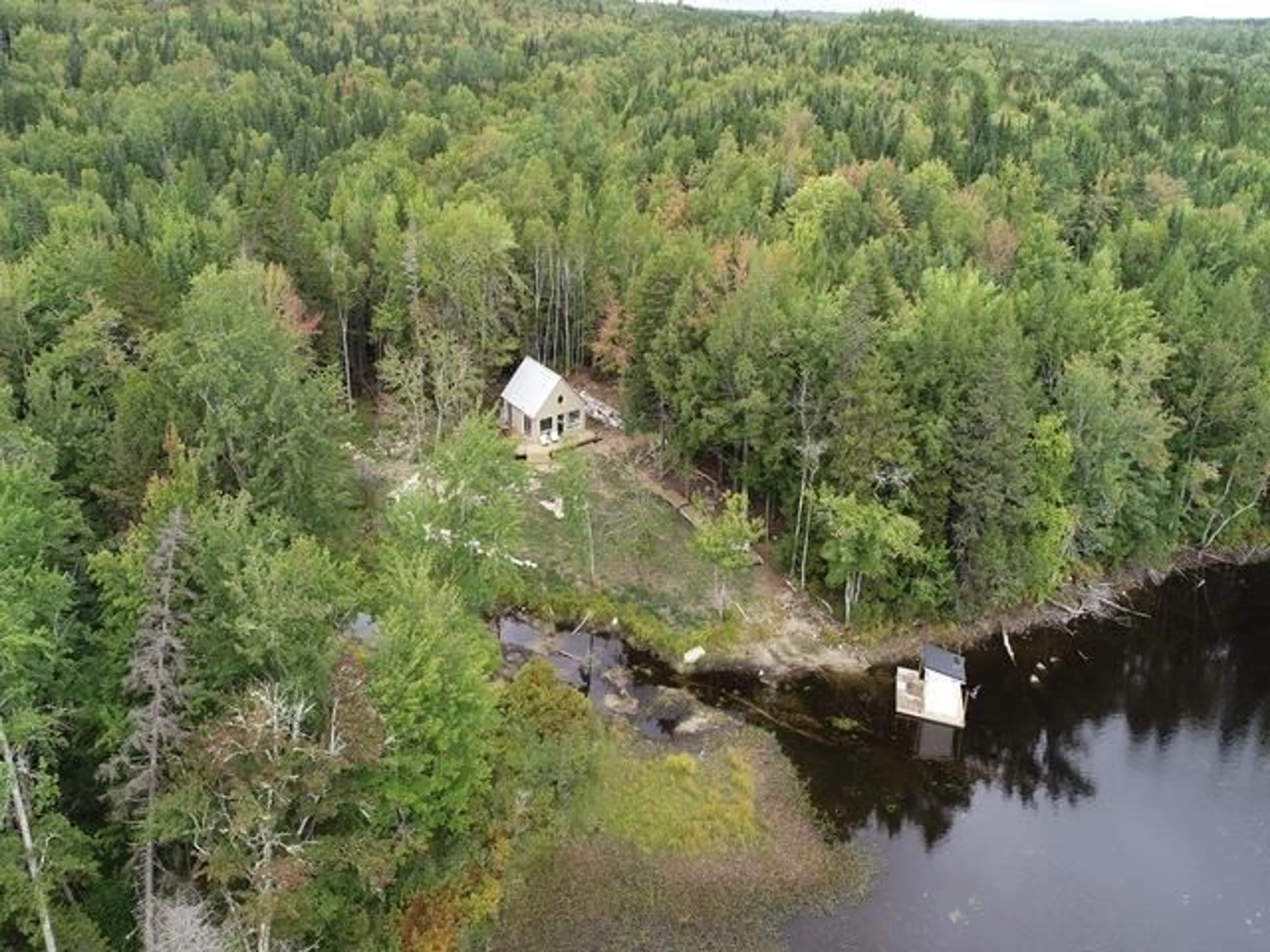A pic from outside/outdoor area/front of a property/back of a property/a pic from drone, water/lake/river/ocean view for 215 Otter Lake Lane, East Dalhousie Nova Scotia B0R 1H0