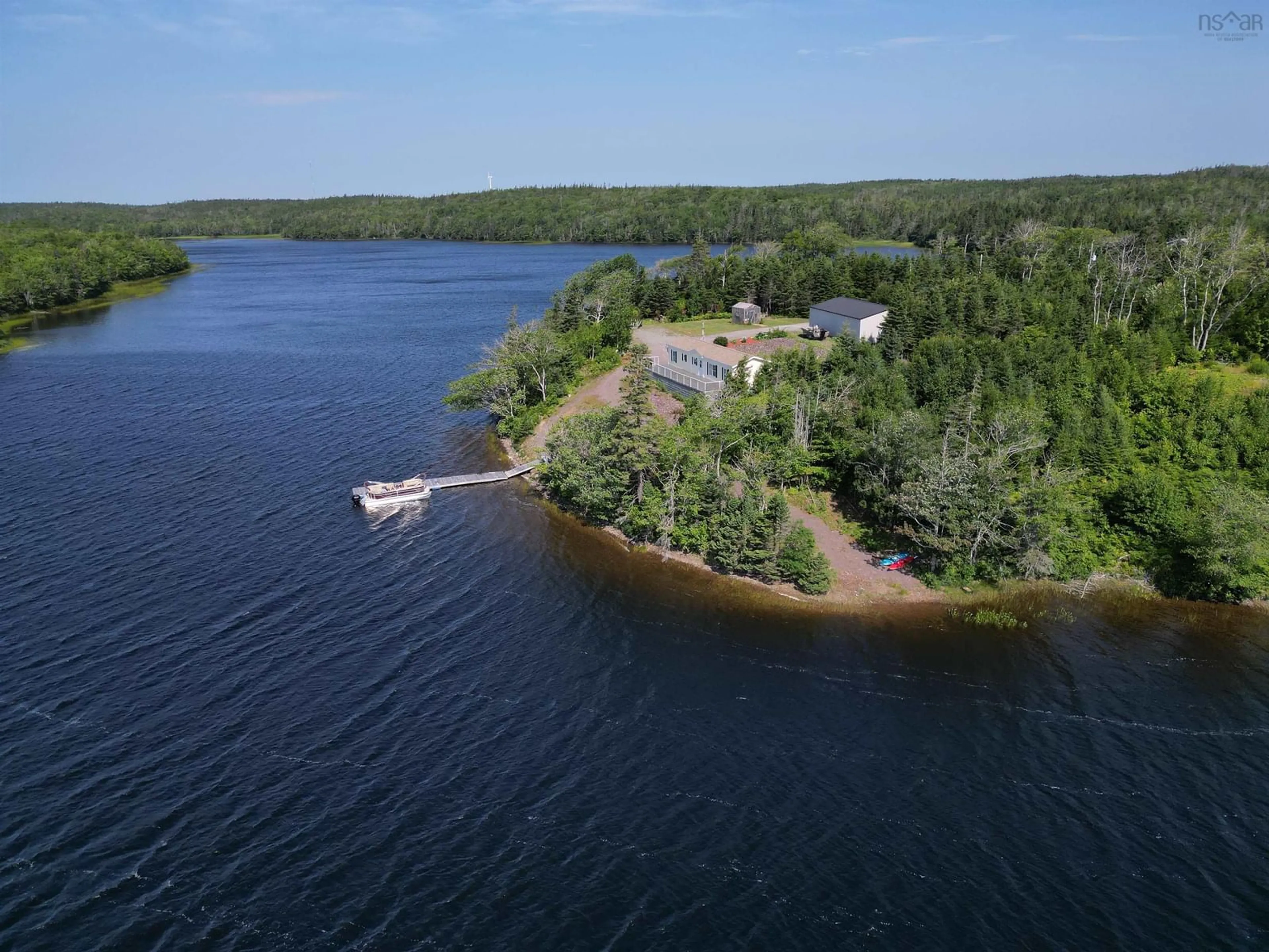 A pic from outside/outdoor area/front of a property/back of a property/a pic from drone, water/lake/river/ocean view for 205 Brodies Rd., D'Escousse Nova Scotia B0E 1K0