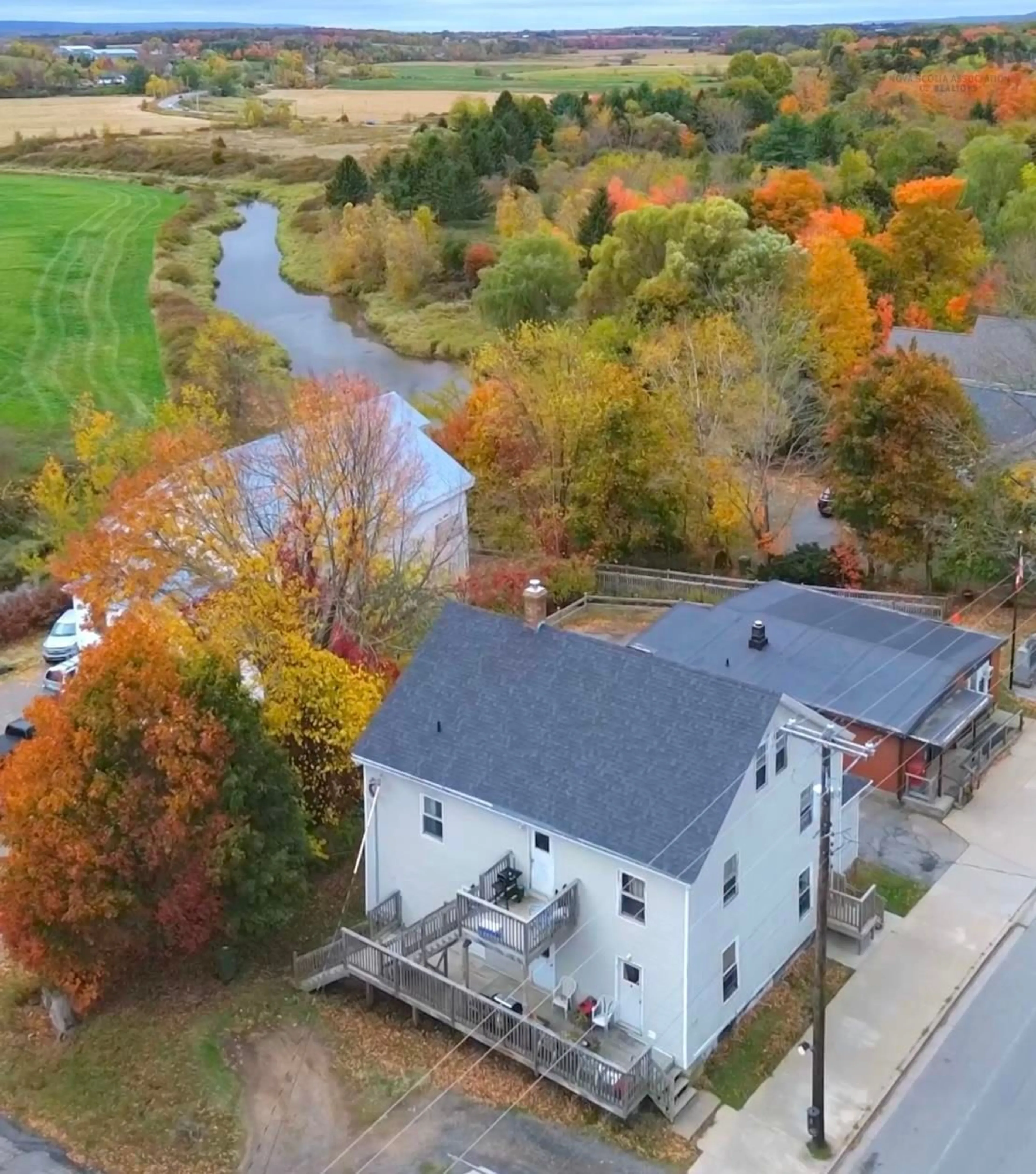 A pic from outside/outdoor area/front of a property/back of a property/a pic from drone, water/lake/river/ocean view for 9800 Main St, Canning Nova Scotia B0P 1H0