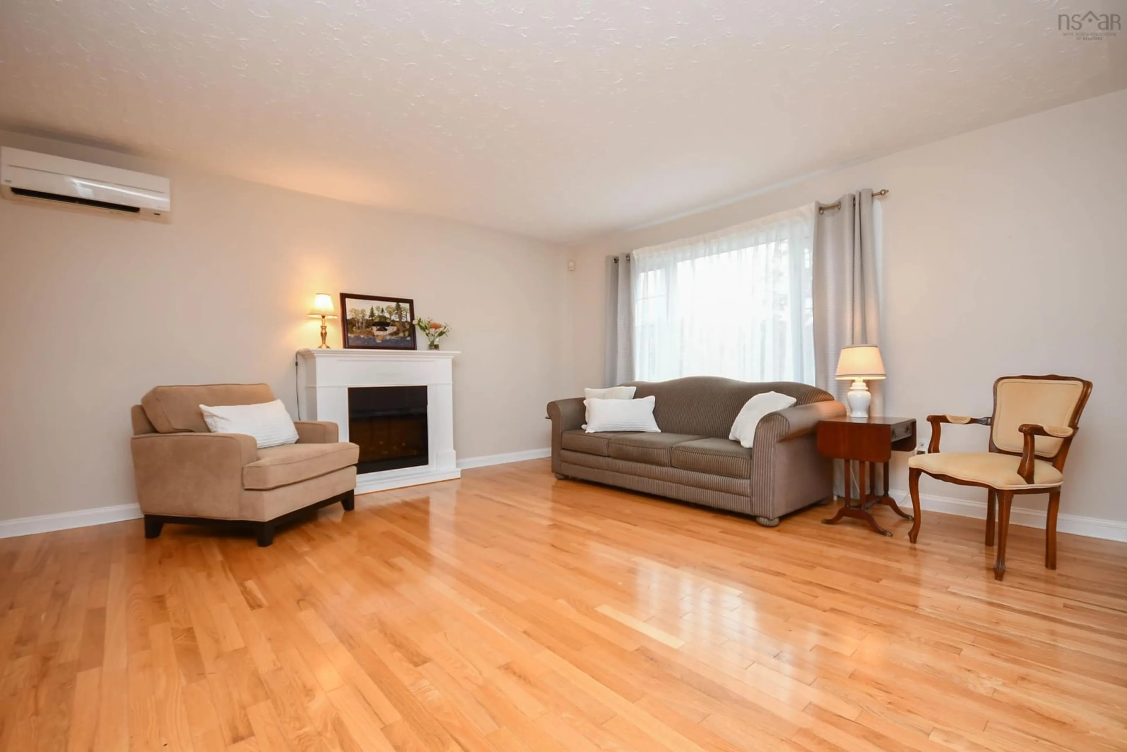 Living room with furniture, wood/laminate floor for 70 Portland Estates Blvd, Dartmouth Nova Scotia B2W 6E5