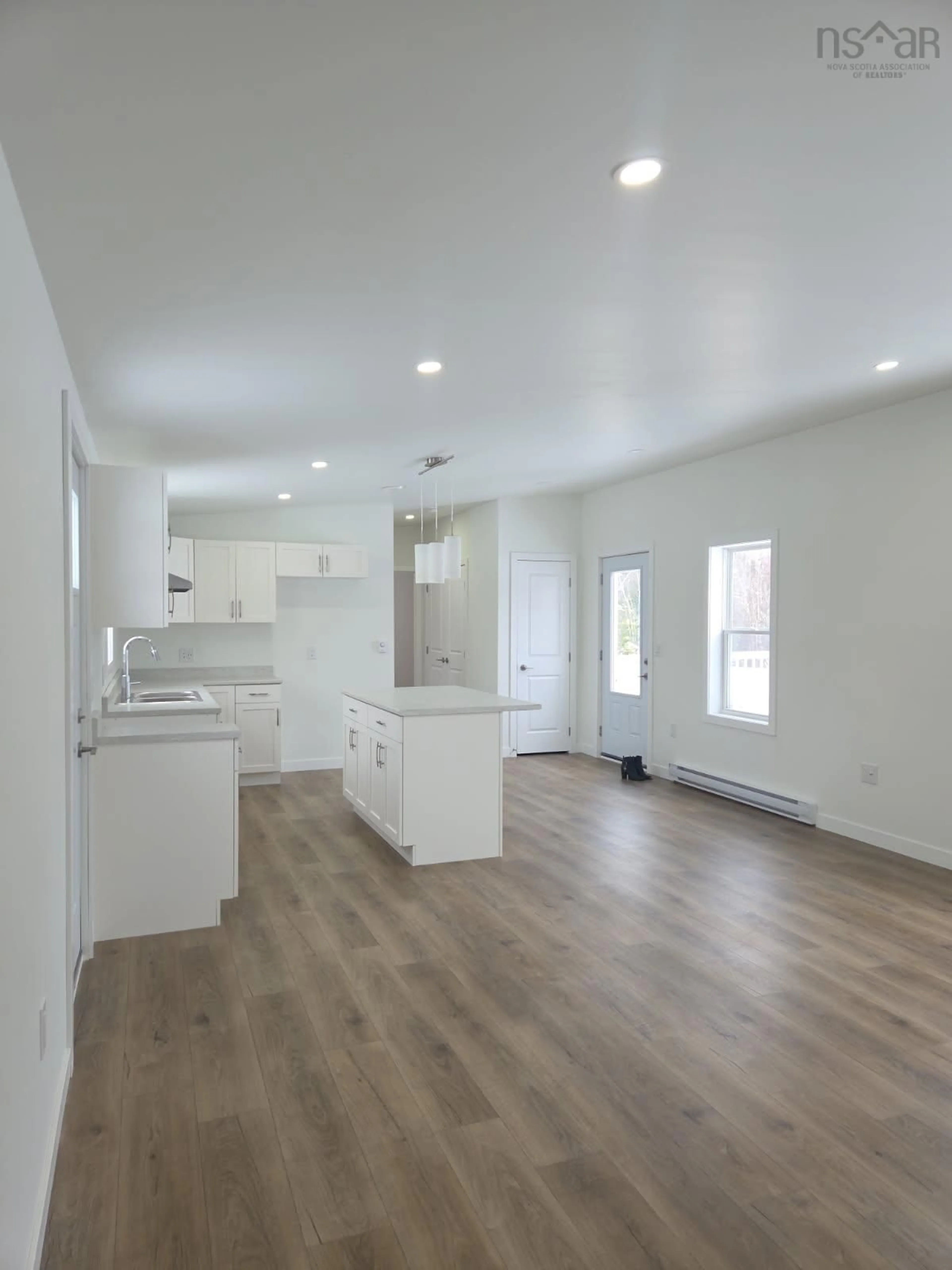 Open concept kitchen, wood/laminate floor for 6 Pebble Lane, West St. Andrews Nova Scotia B0N 2J0