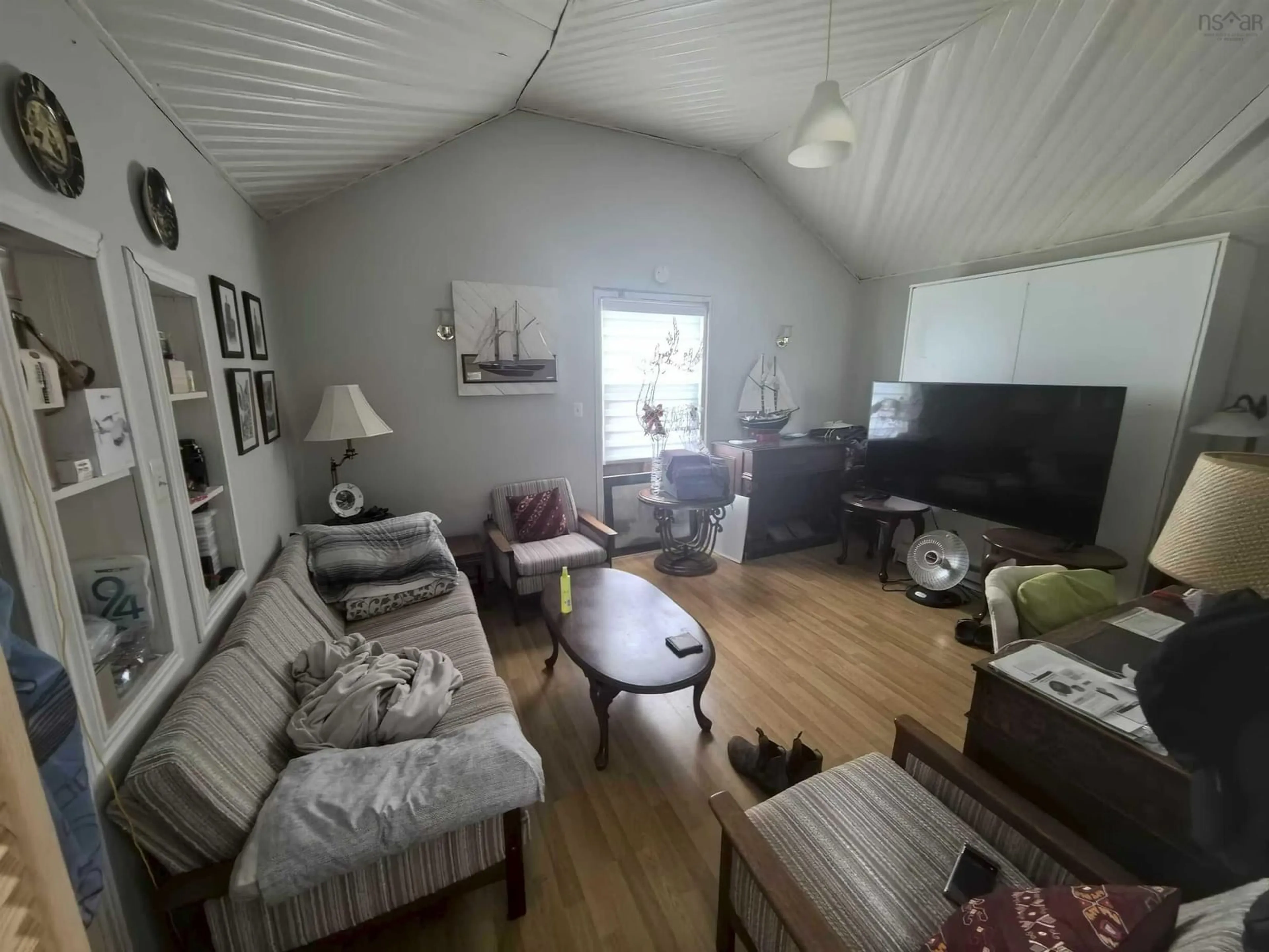 Living room with furniture, unknown for 34 Club Rd, Pinkneys Point Nova Scotia B0W 1B0