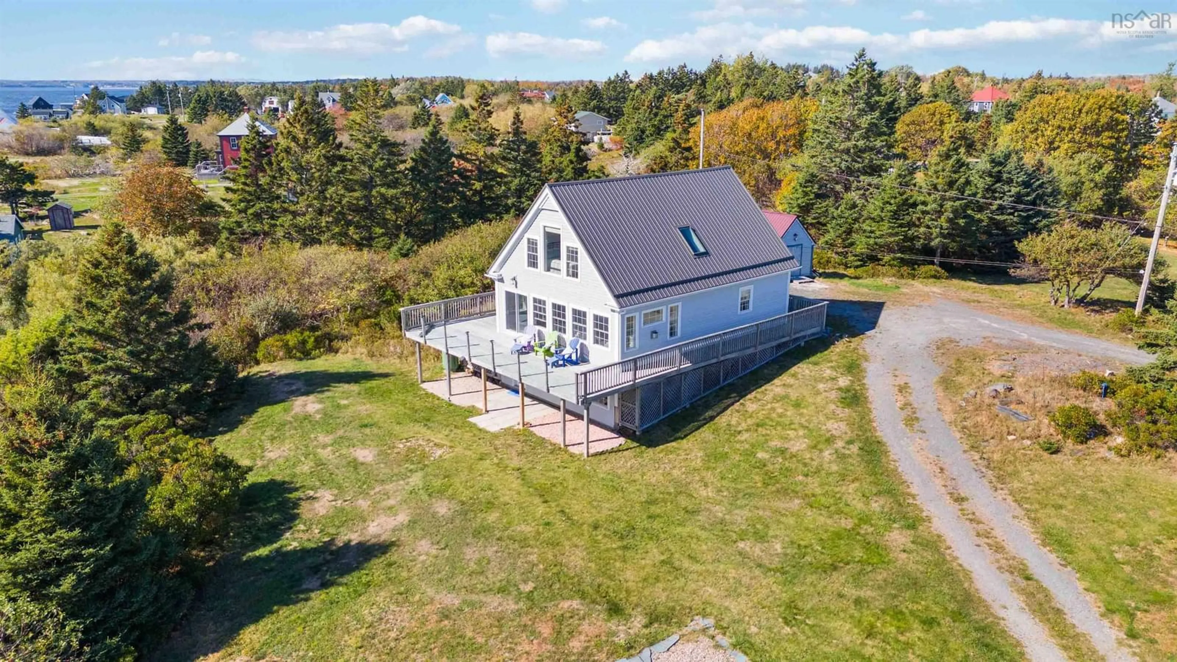 A pic from outside/outdoor area/front of a property/back of a property/a pic from drone, water/lake/river/ocean view for 157 The Point Rd, Blue Rocks Nova Scotia B0J 2C0