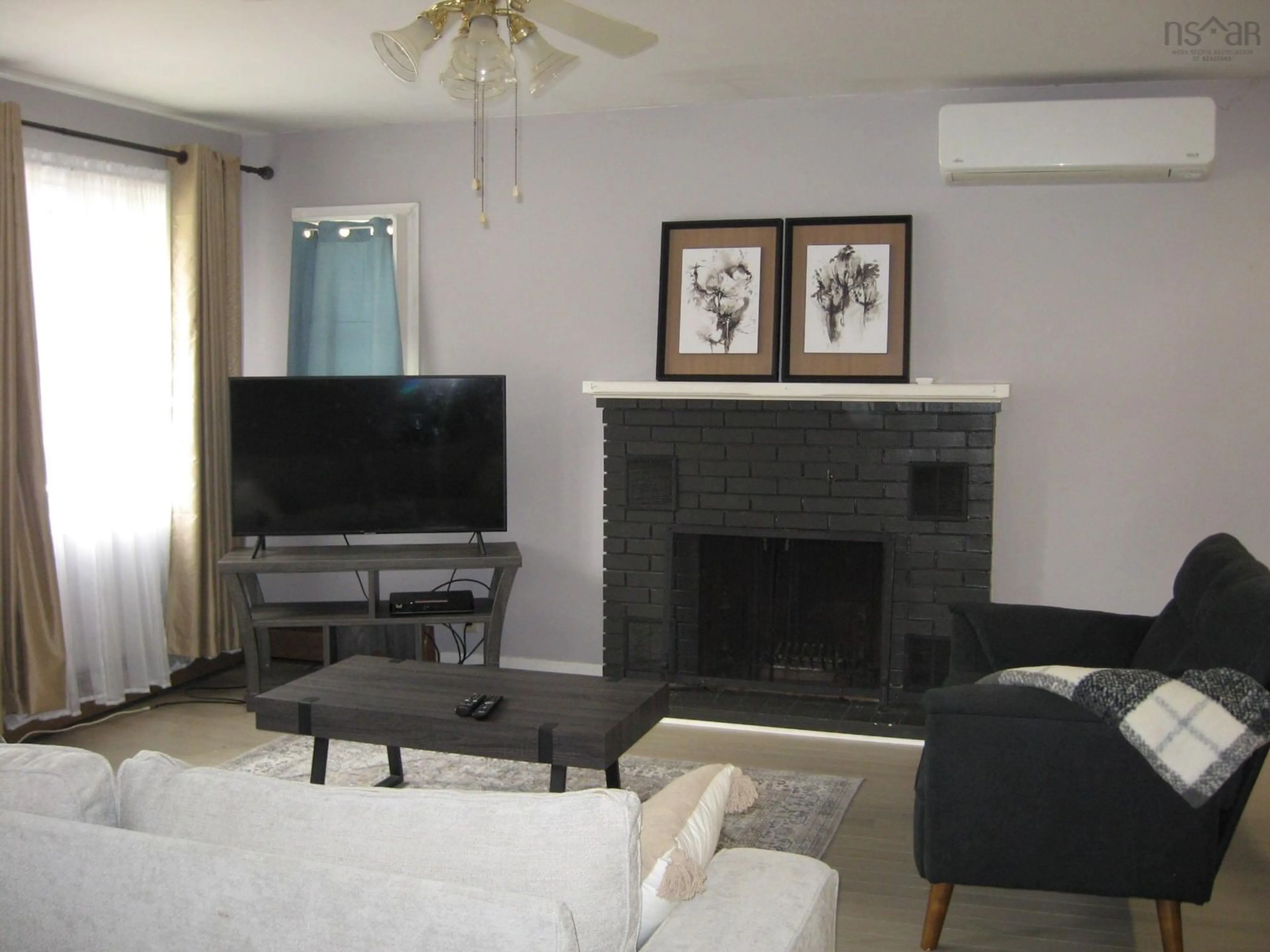Living room with furniture, unknown for 85 School St, Liverpool Nova Scotia B0T 1K0
