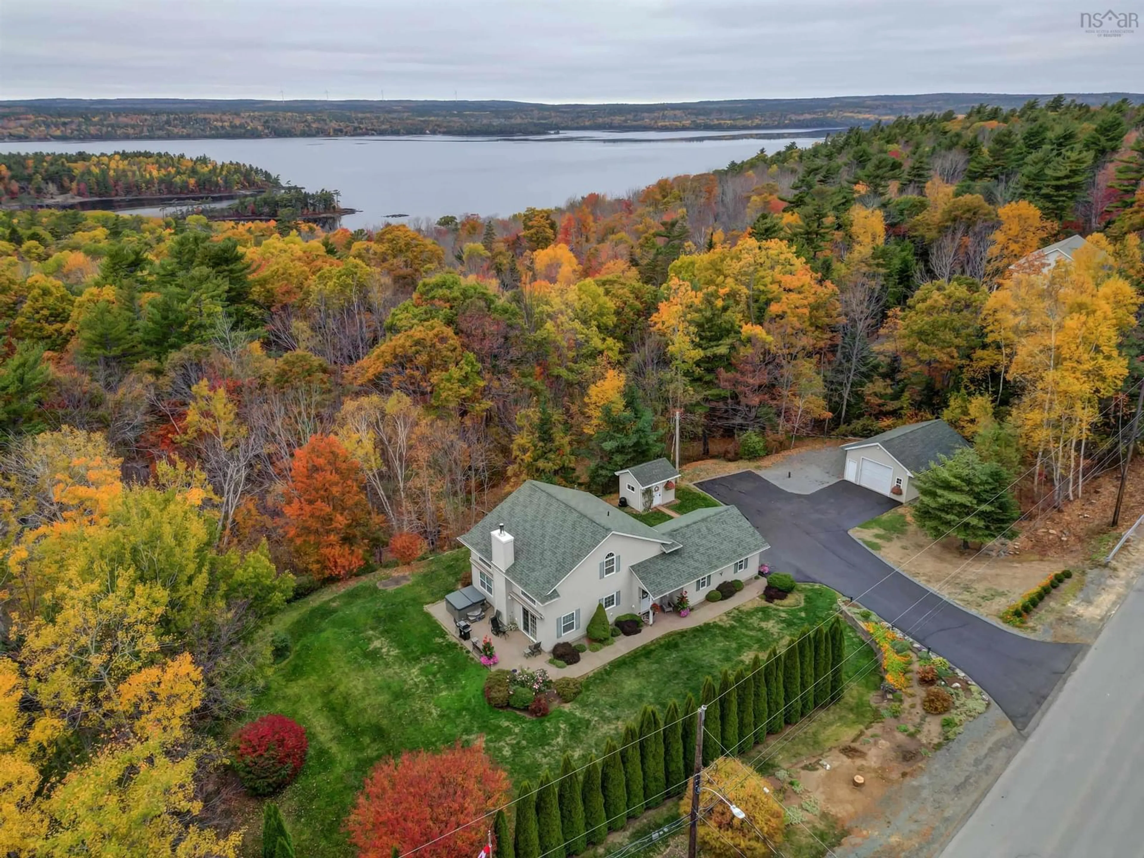 A pic from outside/outdoor area/front of a property/back of a property/a pic from drone, water/lake/river/ocean view for 42 Given Dr, Grand Lake Nova Scotia B2T 0K1