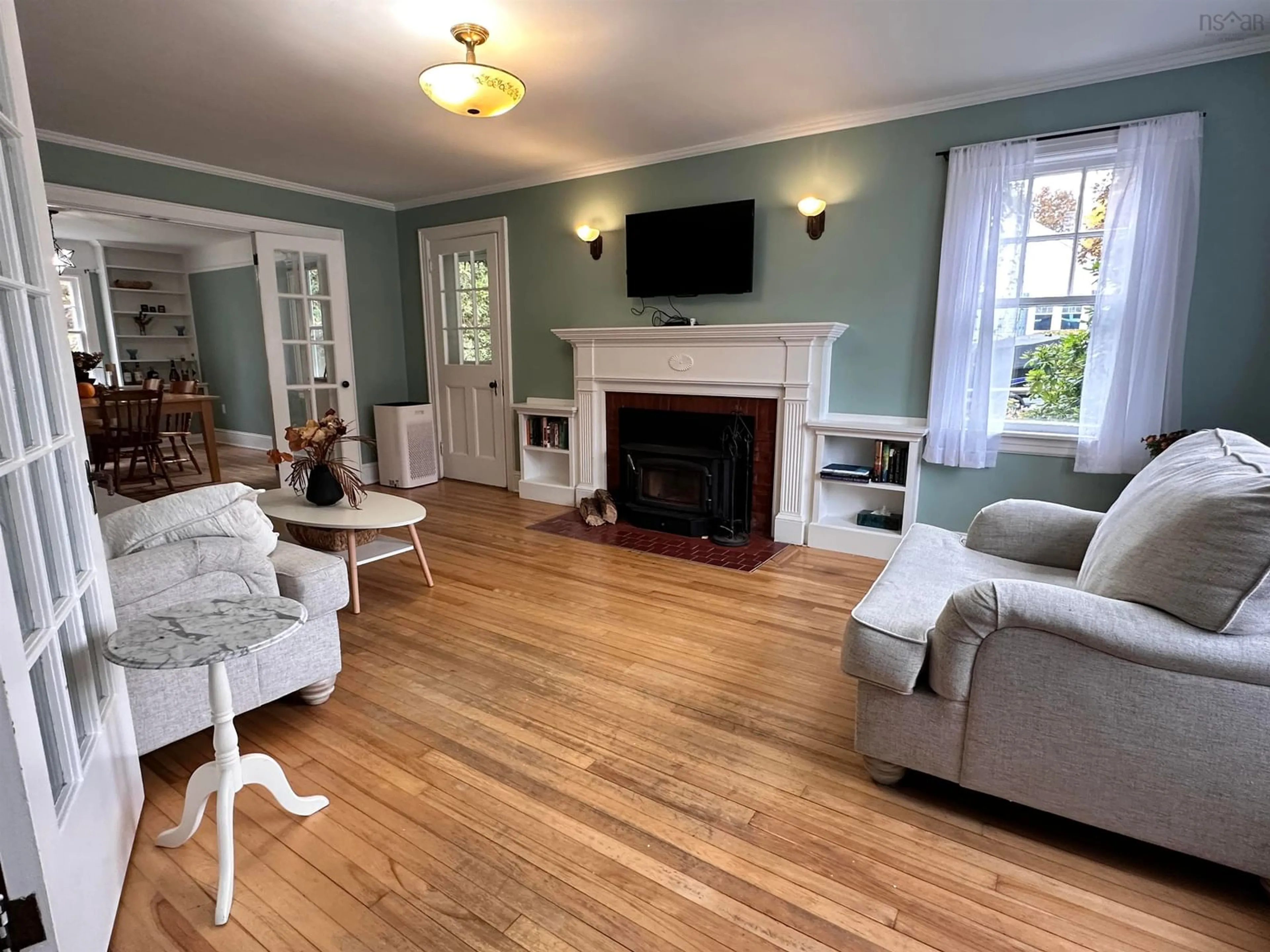 Living room with furniture, wood/laminate floor for 79 Waterloo St, Liverpool Nova Scotia B0T 1K0
