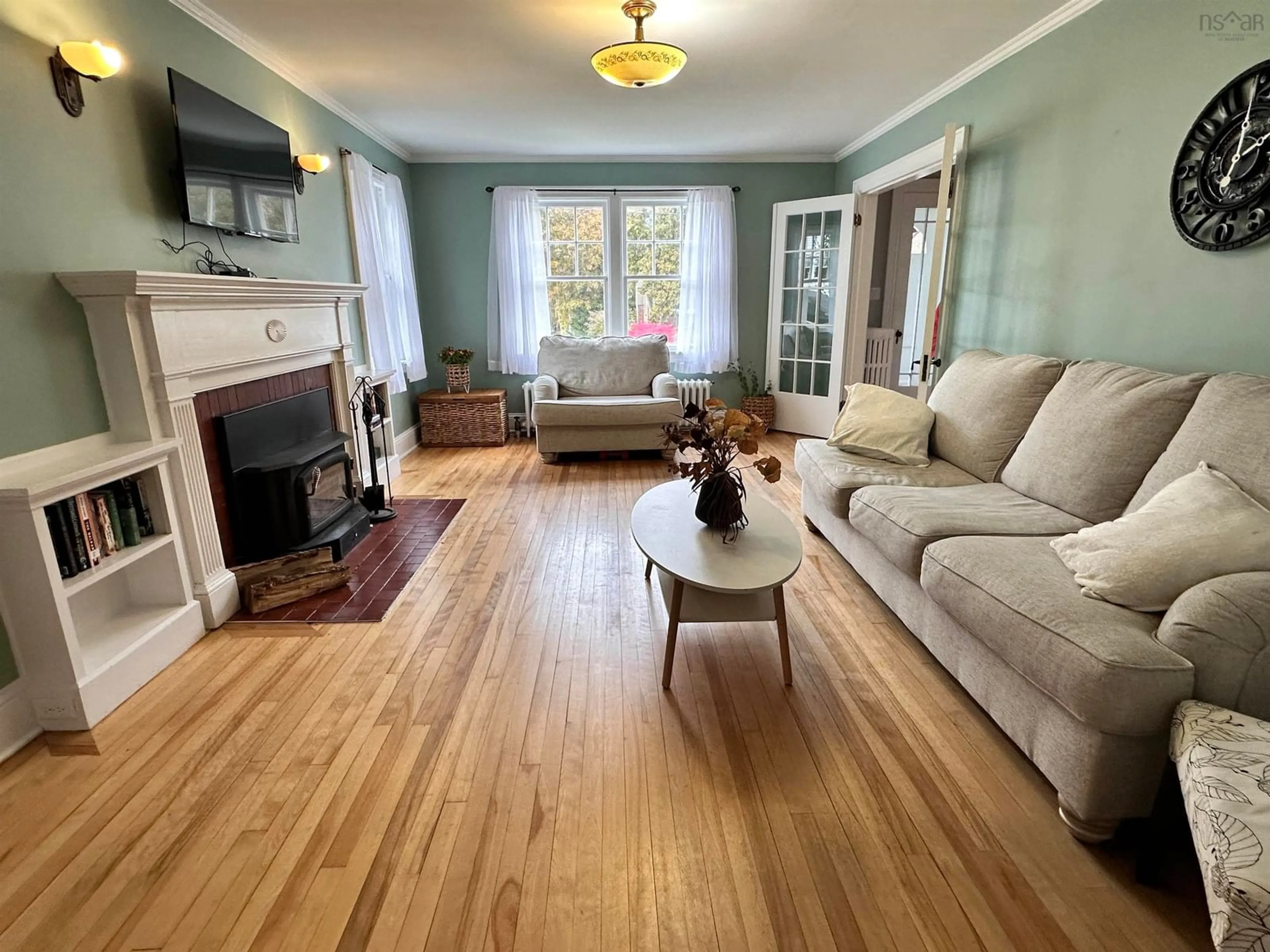Living room with furniture, wood/laminate floor for 79 Waterloo St, Liverpool Nova Scotia B0T 1K0