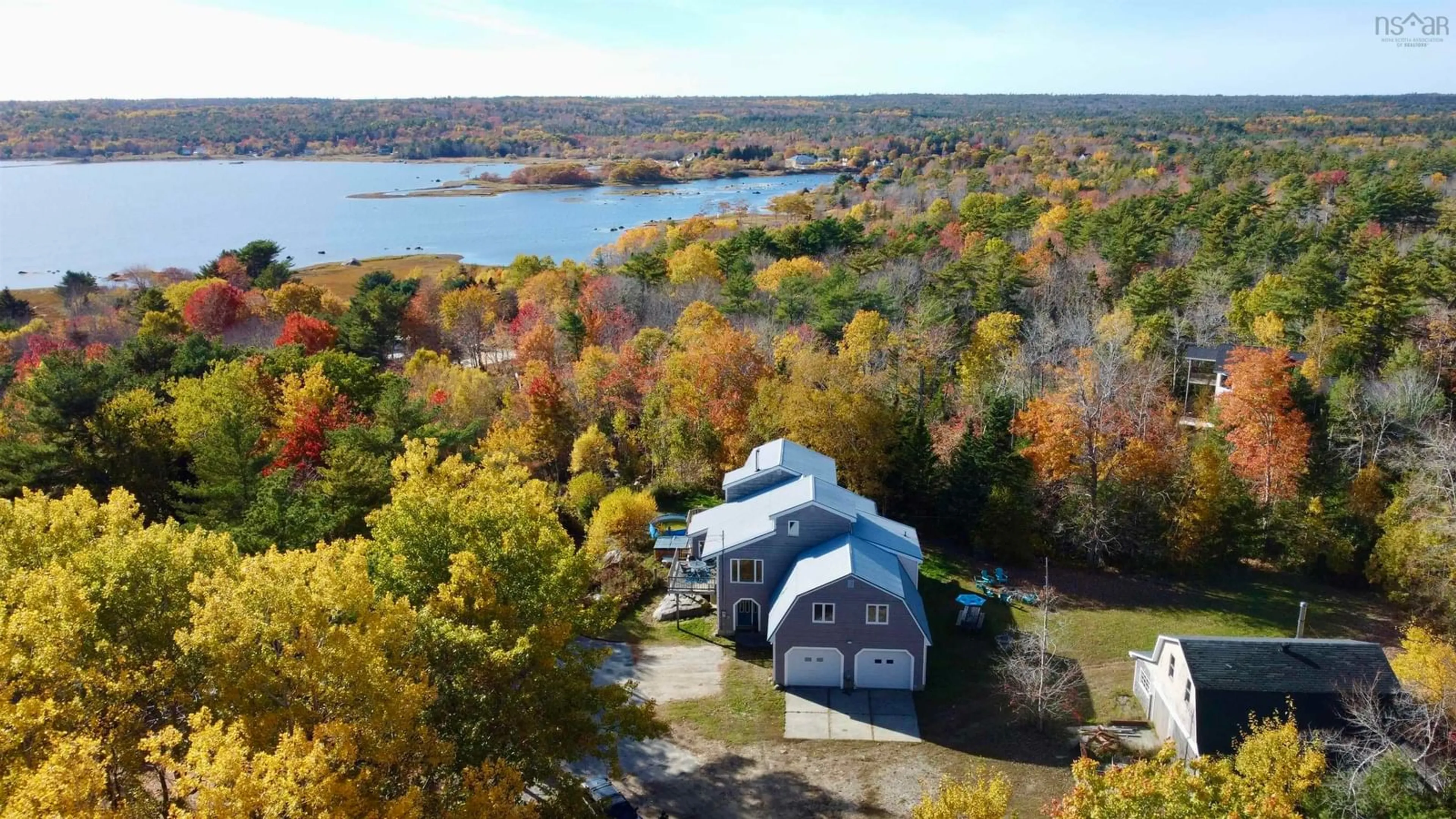 A pic from outside/outdoor area/front of a property/back of a property/a pic from drone, water/lake/river/ocean view for 187 Hartz Point Rd, Shelburne Nova Scotia B0T 1W0