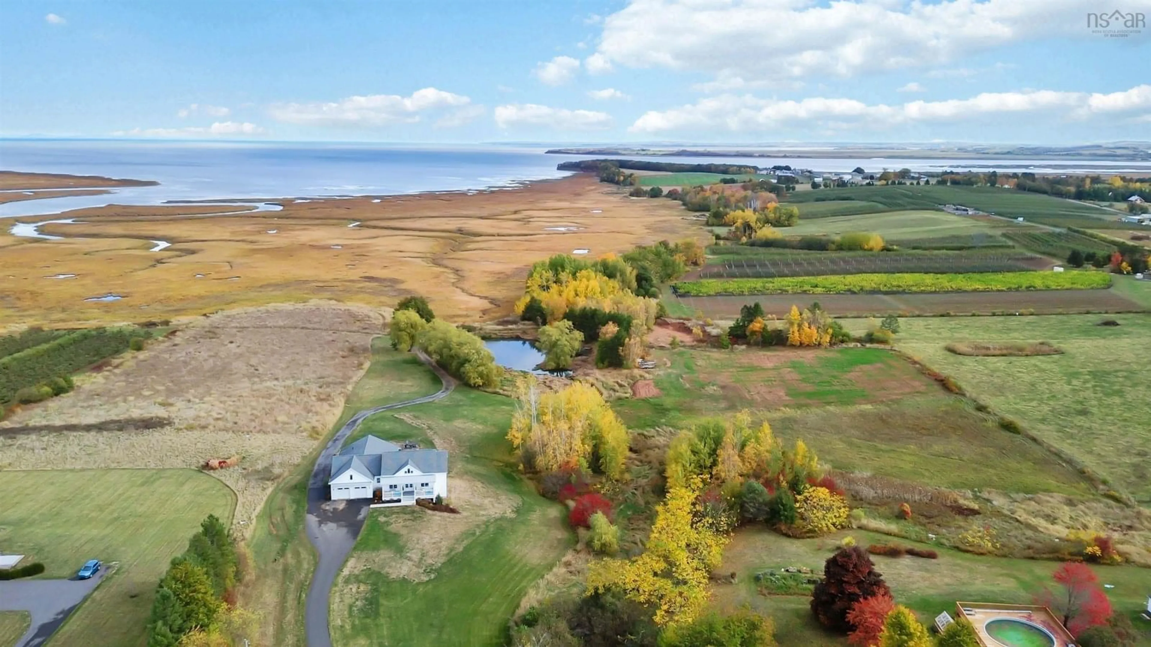 A pic from outside/outdoor area/front of a property/back of a property/a pic from drone, water/lake/river/ocean view for 70 Wellington Dyke Rd, Port Williams Nova Scotia B0P 1T0