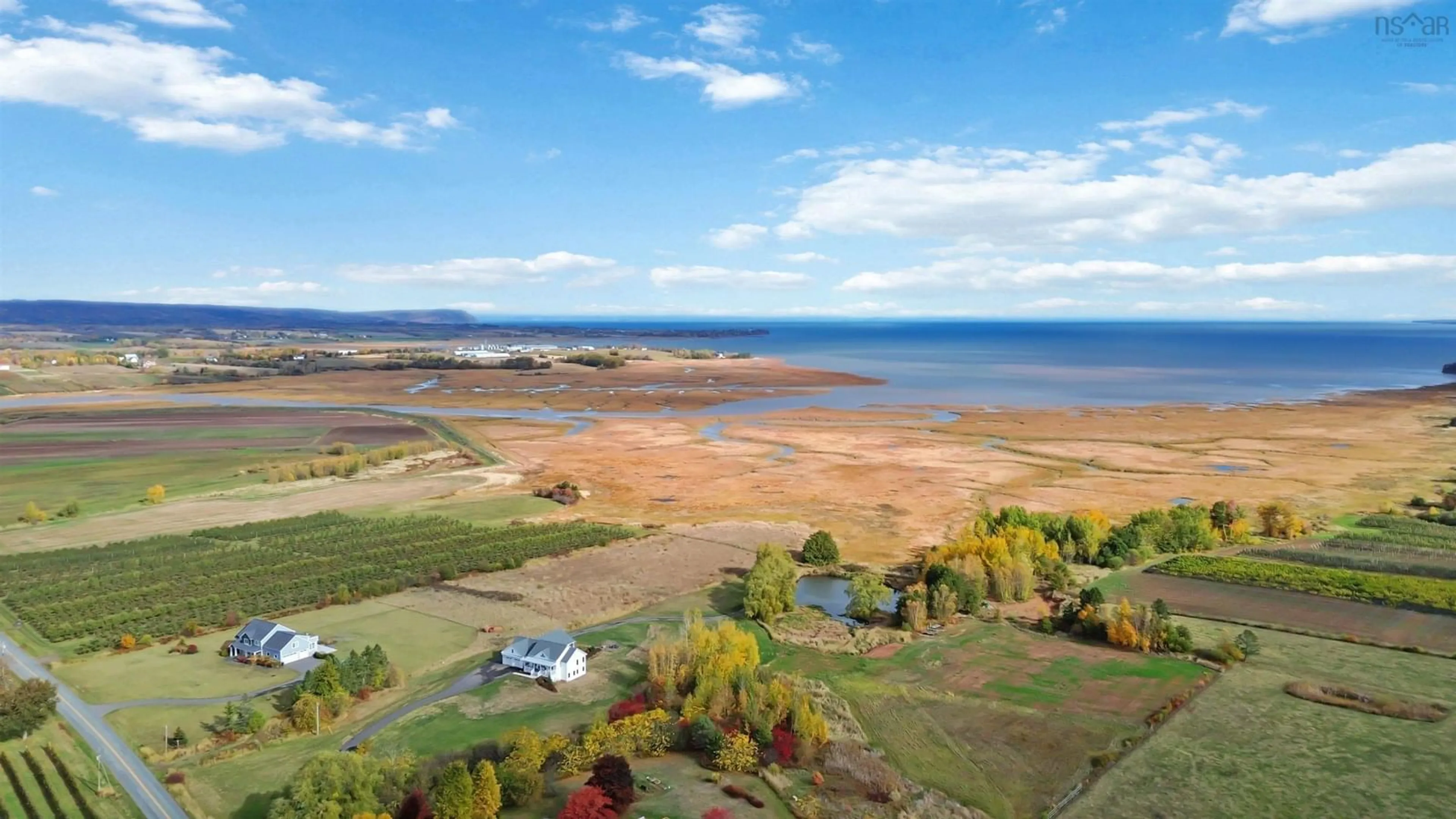 A pic from outside/outdoor area/front of a property/back of a property/a pic from drone, water/lake/river/ocean view for 70 Wellington Dyke Rd, Port Williams Nova Scotia B0P 1T0
